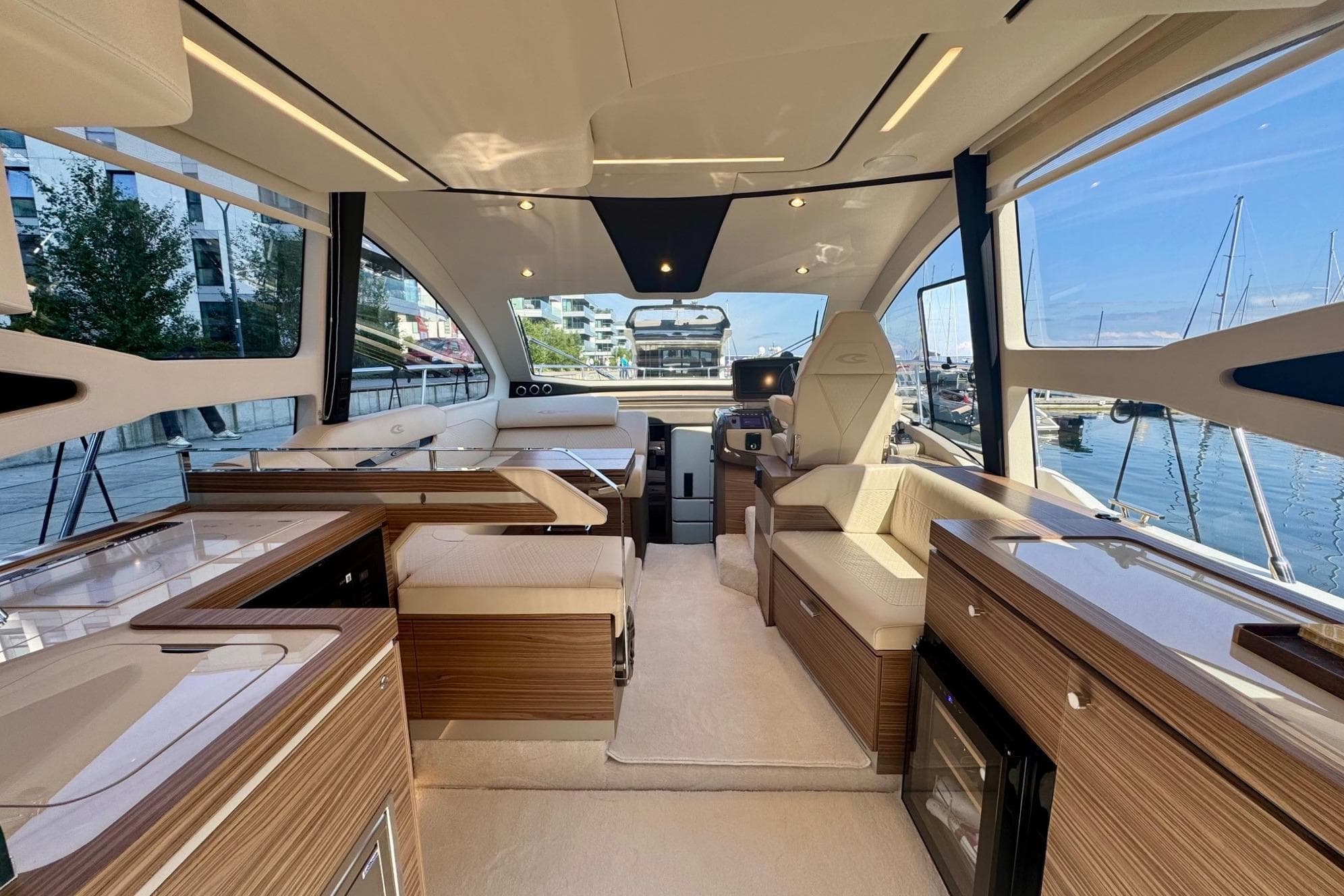 Luxurious interior of 2026 Cobrey 45 FLY yacht with modern design and waterfront view.