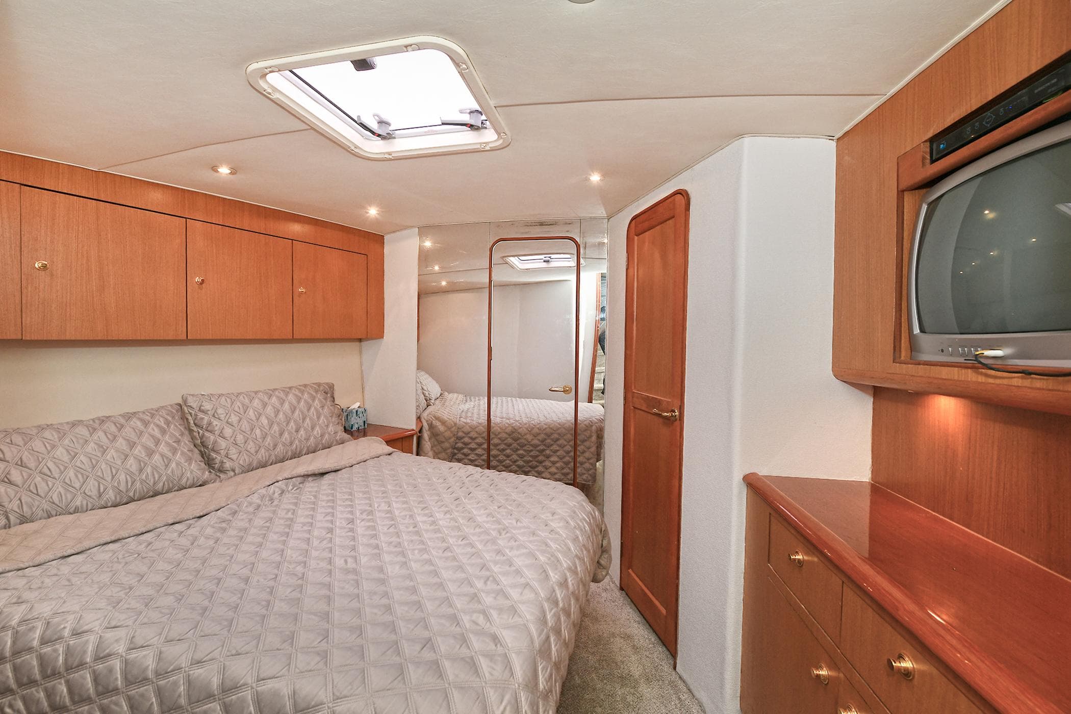 Luxurious bedroom on Ocean Yachts 52 Super Sport 2001.