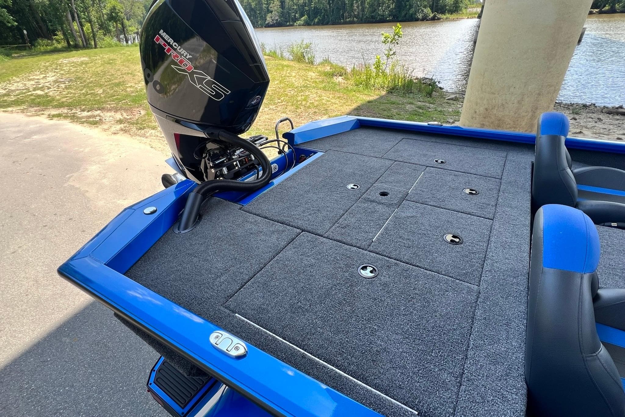 2022 Vexus AVX 2080 boat with Mercury Pro XS engine, parked near a lake.
