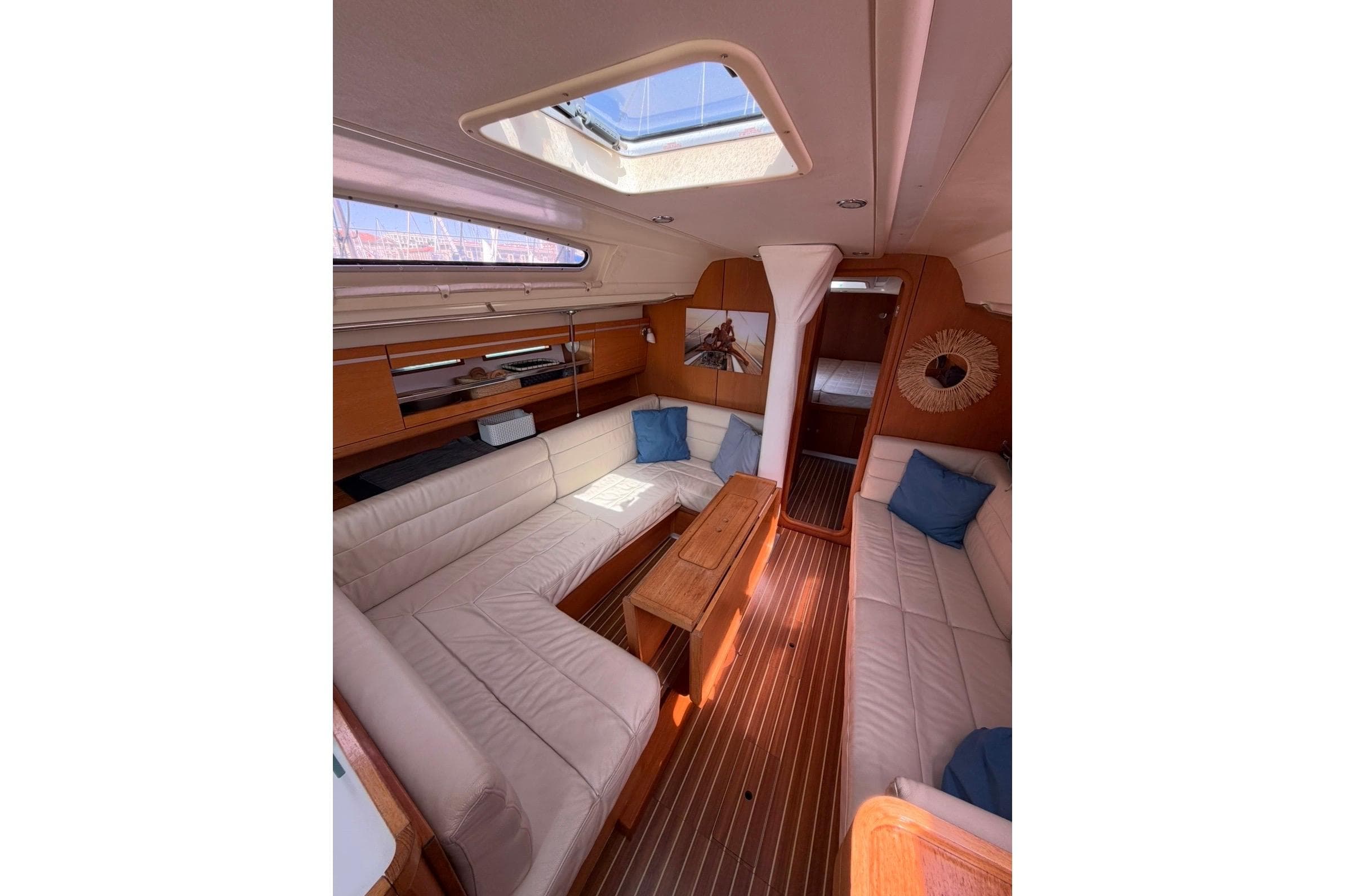 Interior of 2011 Dehler 45 yacht with elegant seating and wooden finishes.