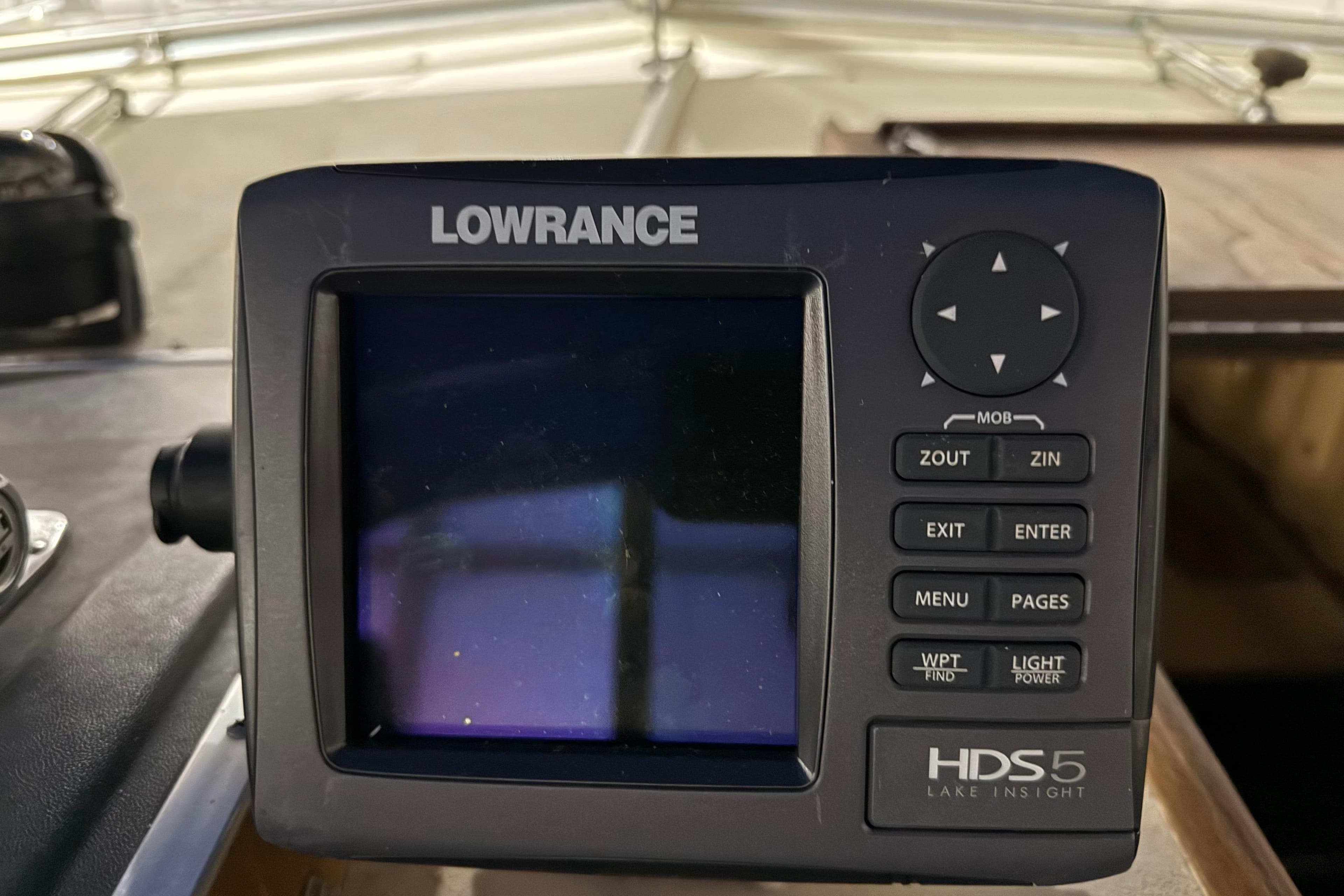 Lowrance HDS5 marine GPS unit on 1979 Chris-Craft 350 Catalina boat dashboard.