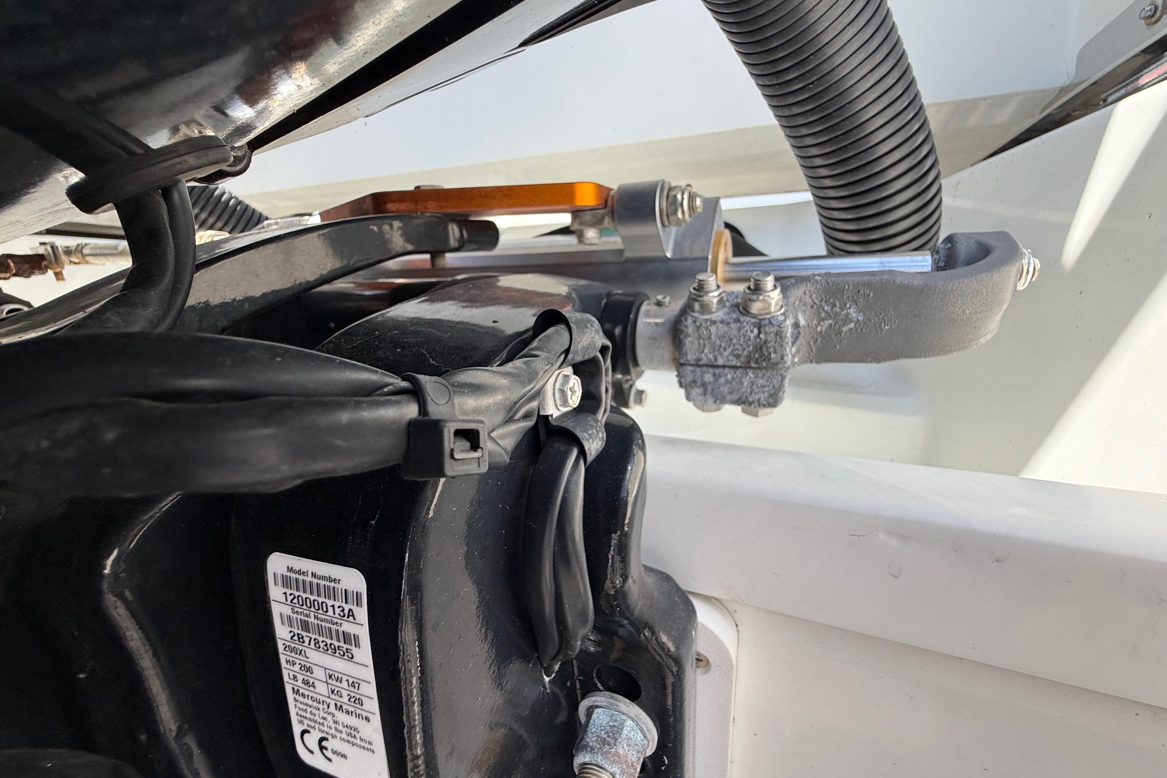 Close-up of Jeanneau NC 895 boat engine components, showcasing wiring and mechanical parts.