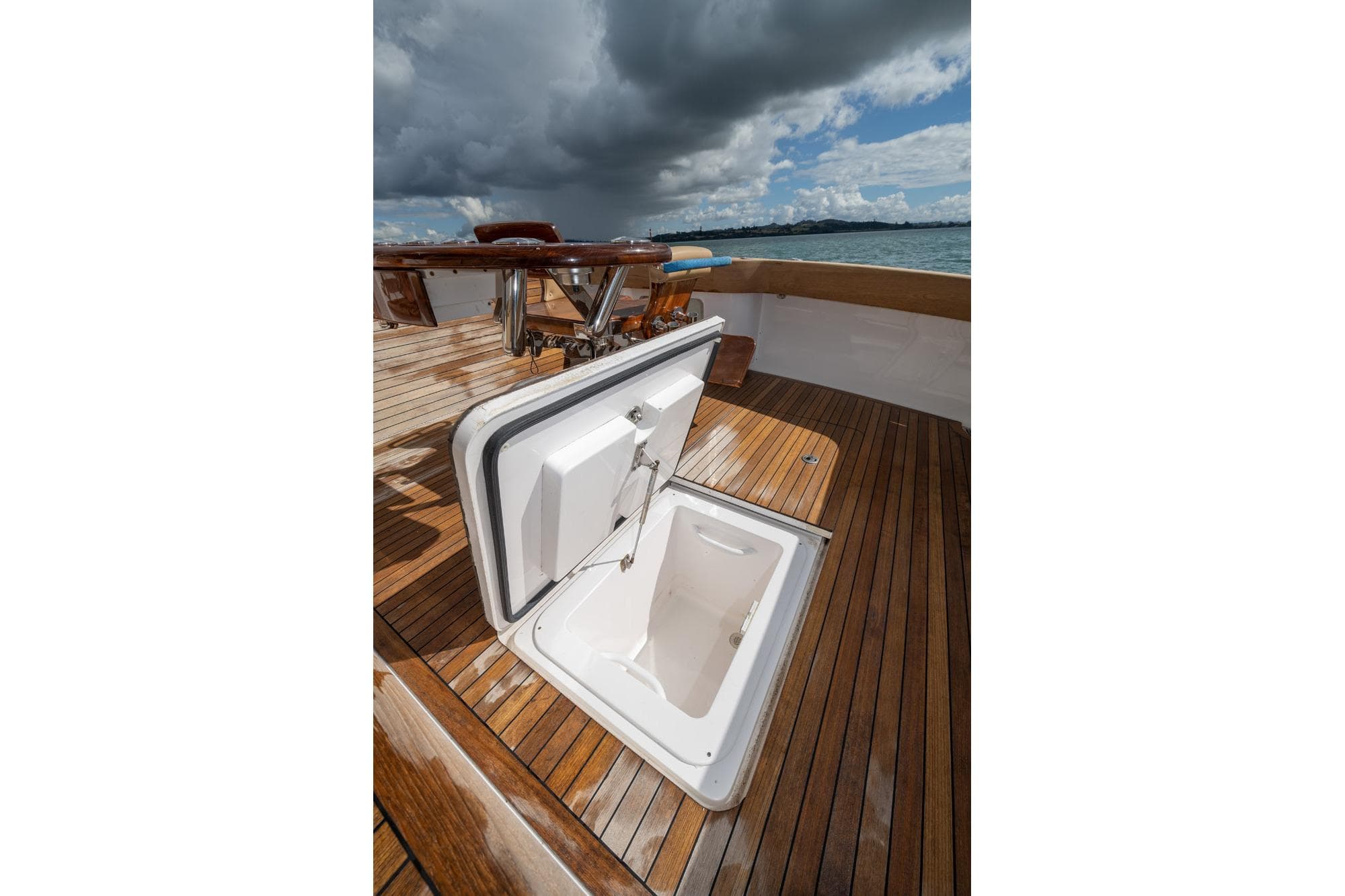 Open hatch on 2007 Viking 64 Convertible yacht deck under cloudy sky.