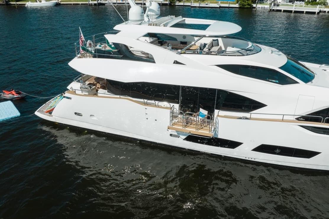 2018 Sunseeker 95 Yacht on water, showcasing sleek design and luxurious features.