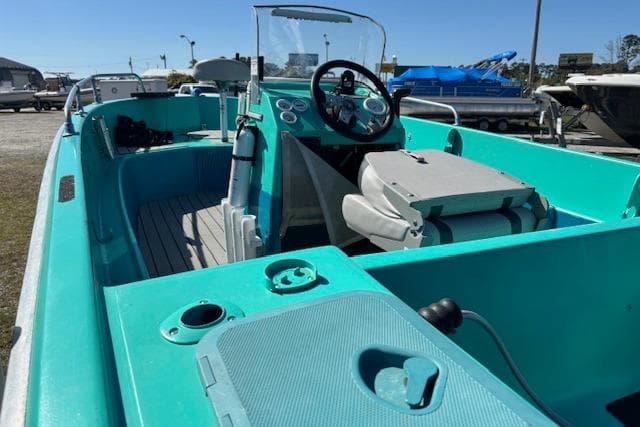 1971 Chrysler 15 CC boat with turquoise interior and steering console.