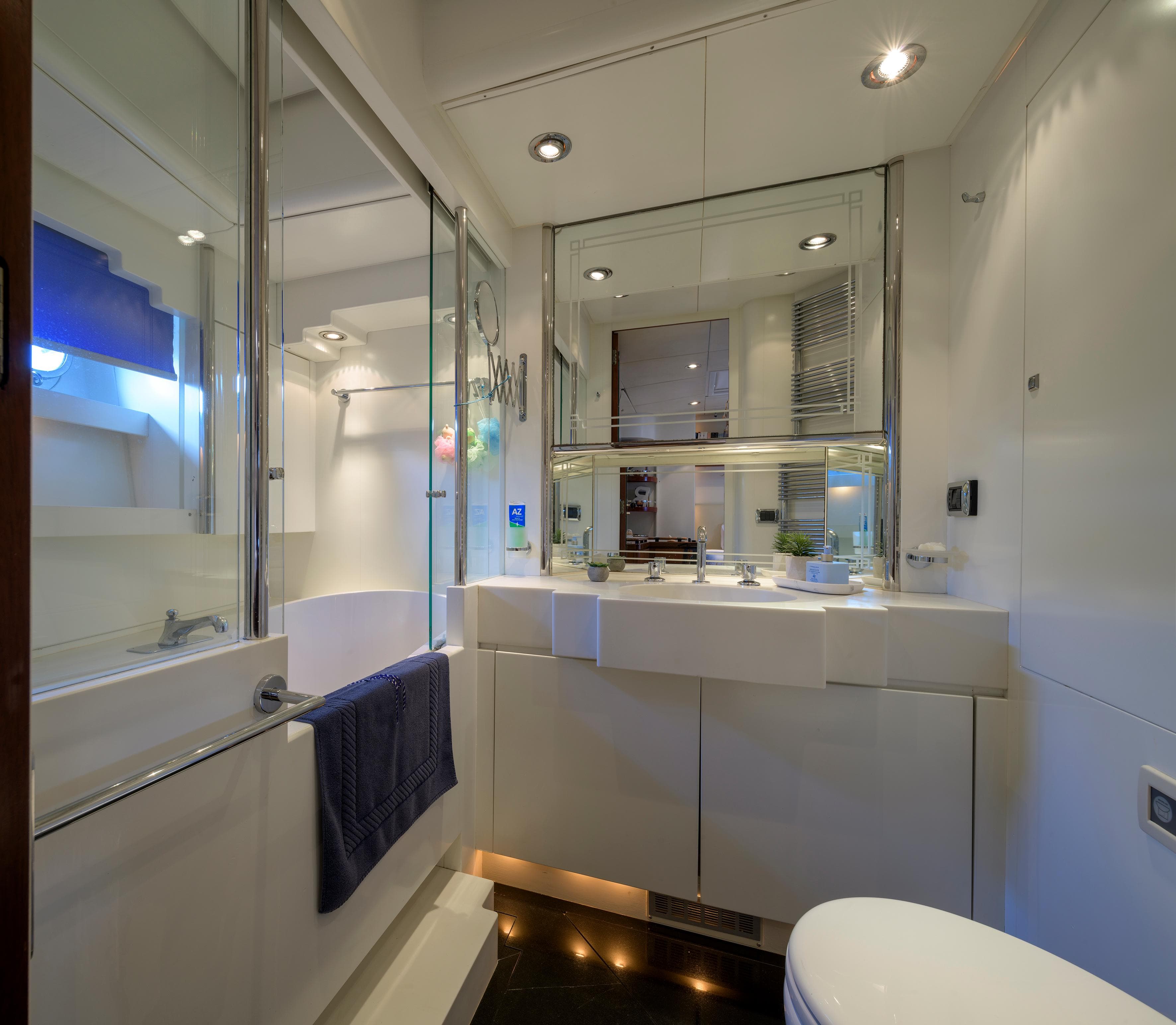 Luxurious bathroom in 1994 Royal Huisman 112' Custom yacht, featuring modern fixtures and elegant design.