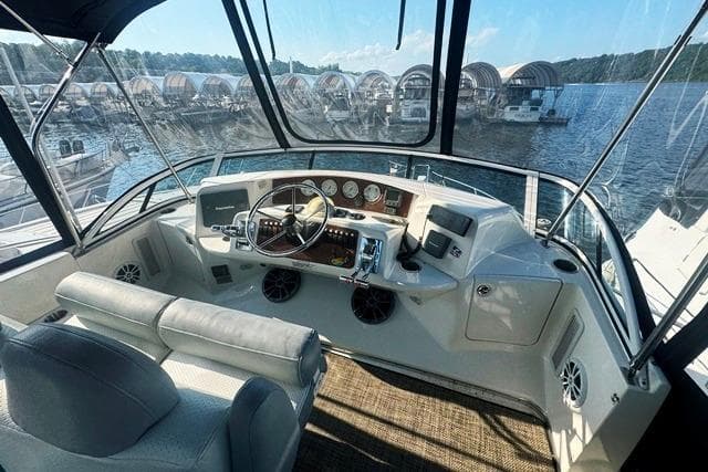 2004 Silverton 35 MY Aft Cabin Motoryacht helm with marina view.