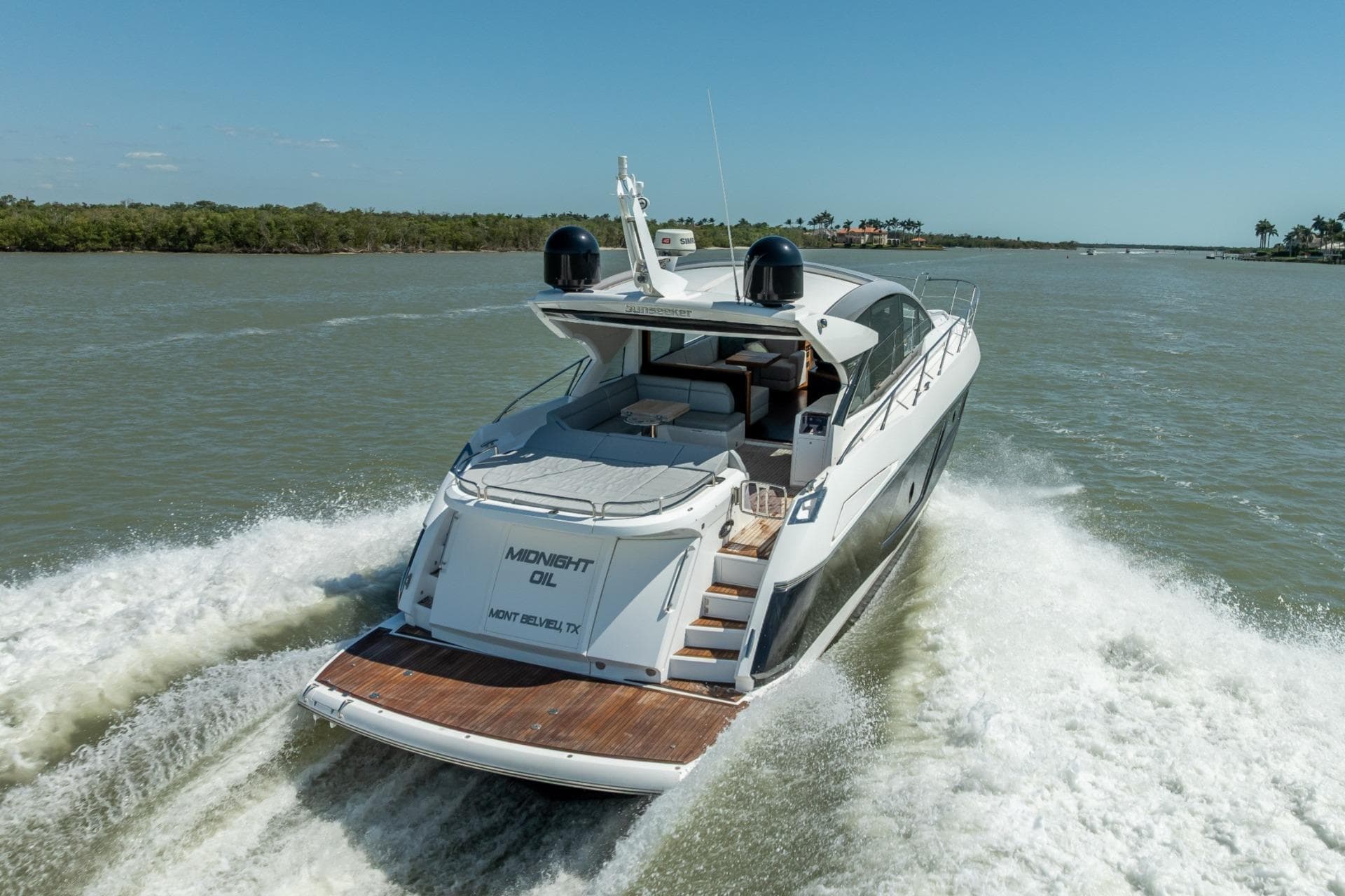2018 Sunseeker Predator 57 yacht cruising on a sunny day.