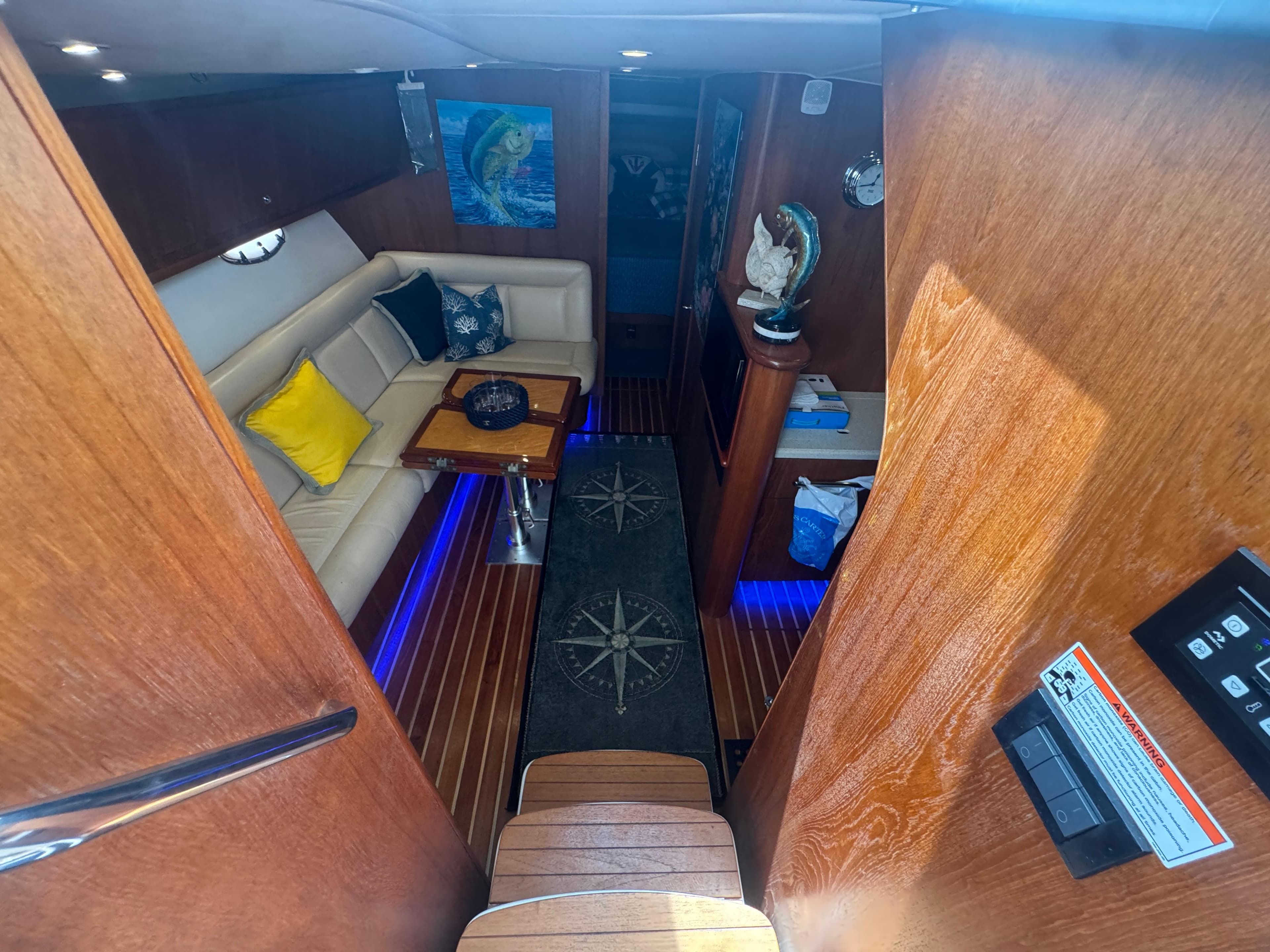 Luxurious interior of 2006 Tiara Yachts 4200 Open with cozy seating and nautical decor.