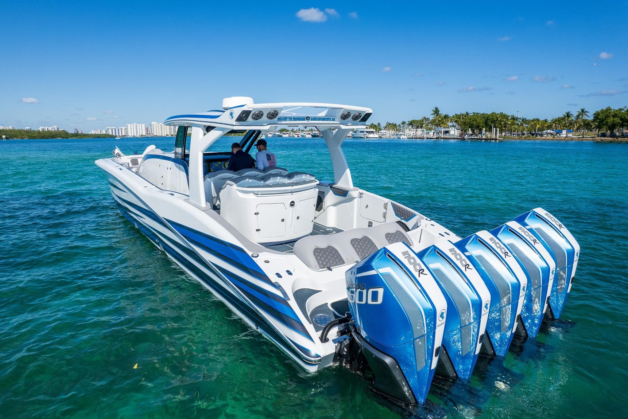 2023 MTI 50v boat with five powerful outboard engines on clear blue water.