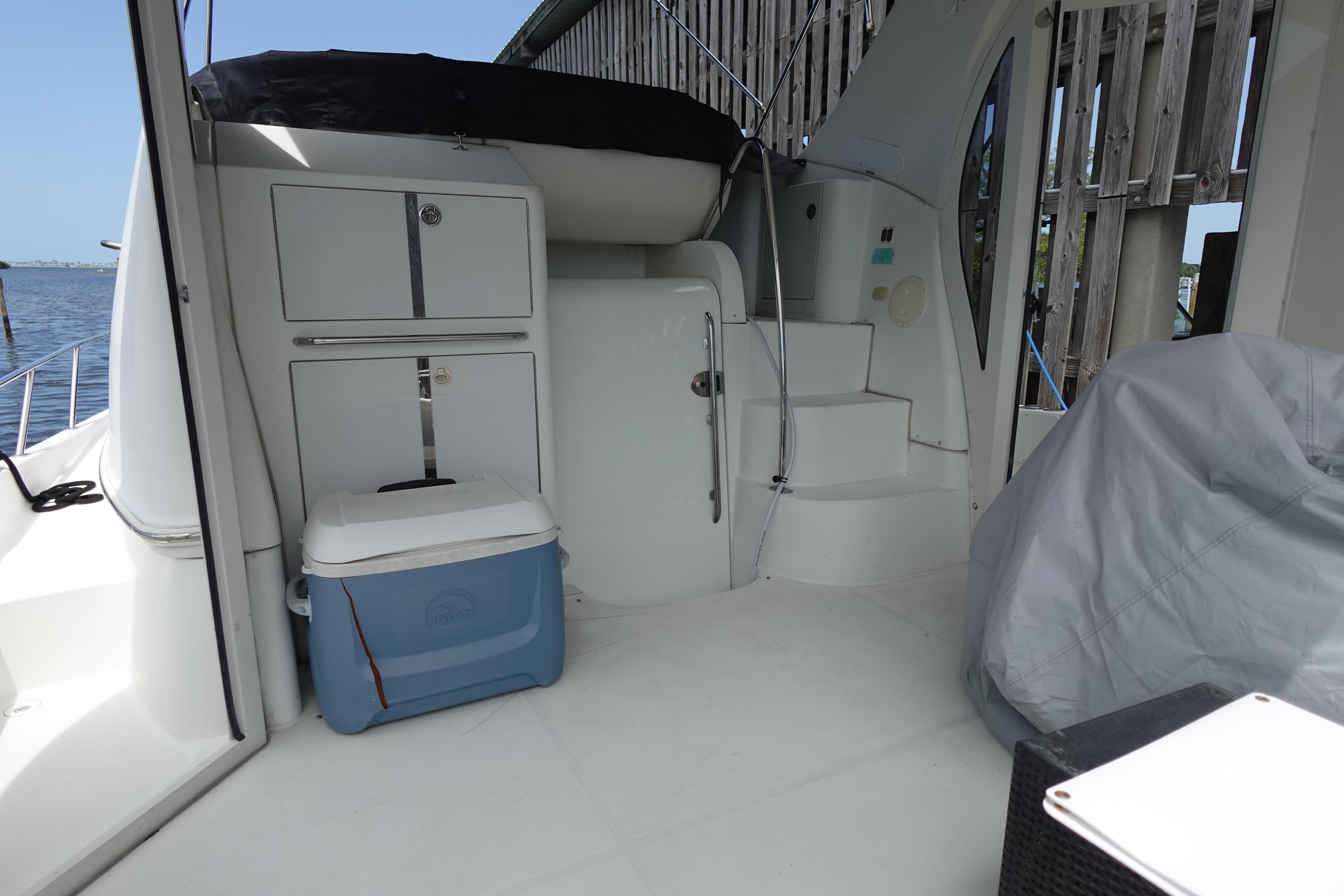 2004 Carver 396 Aft Cabin MY boat interior with cooler and storage cabinets.