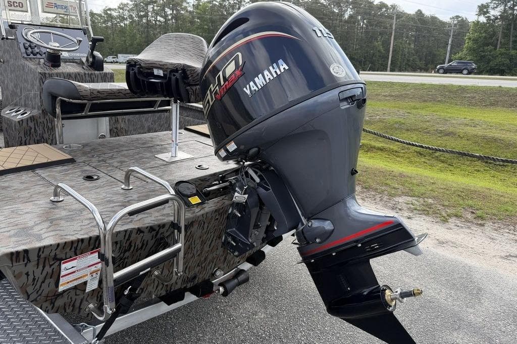 2026 Xpress H190B Bay boat with Yamaha outboard motor, parked on roadside.
