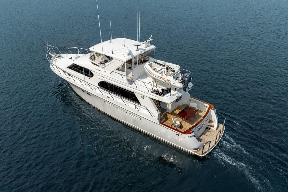 2005 Ocean Alexander 64 Motoryacht cruising on open water, aerial view.