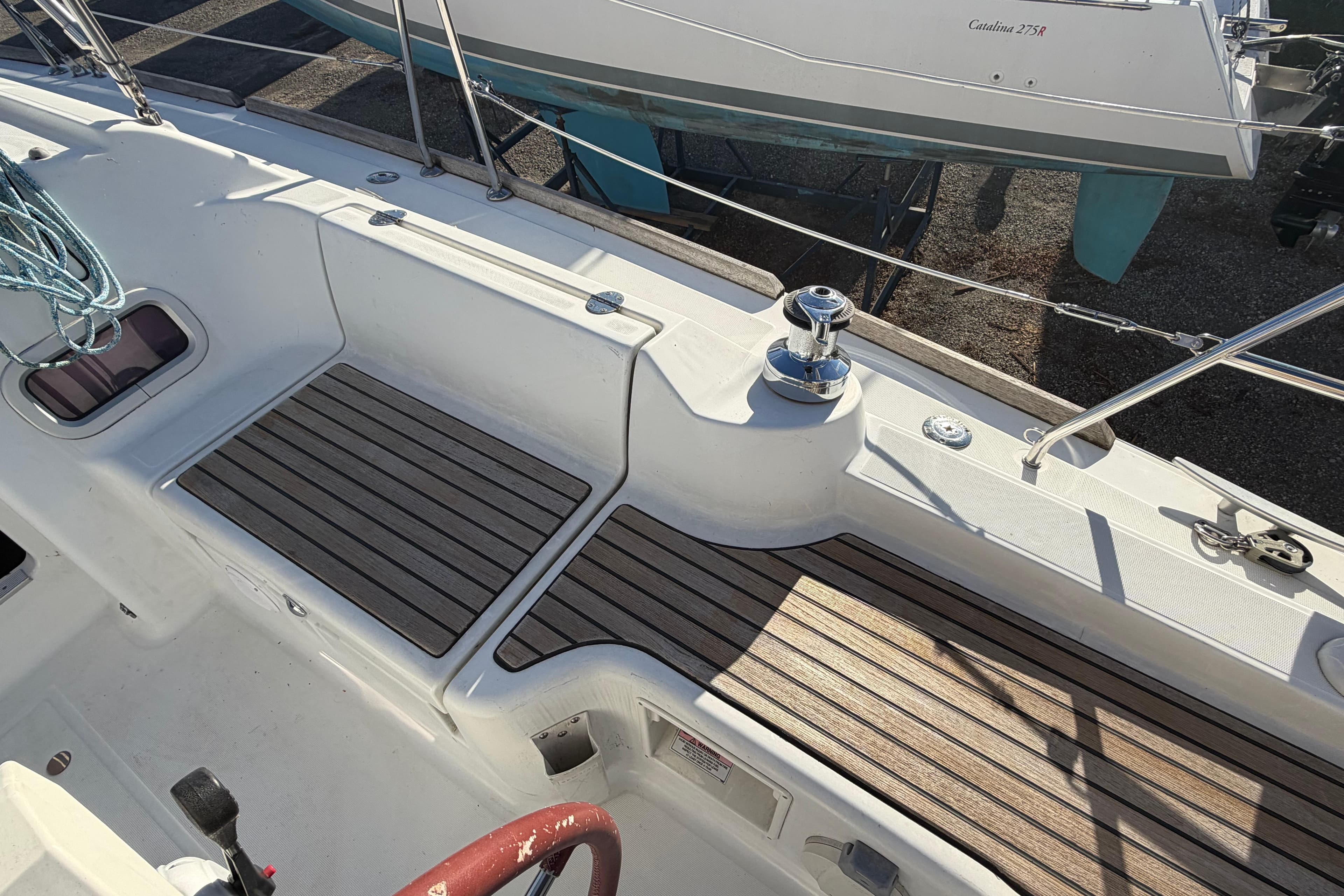 2008 Beneteau 31 sailboat deck with wood accents and winch.