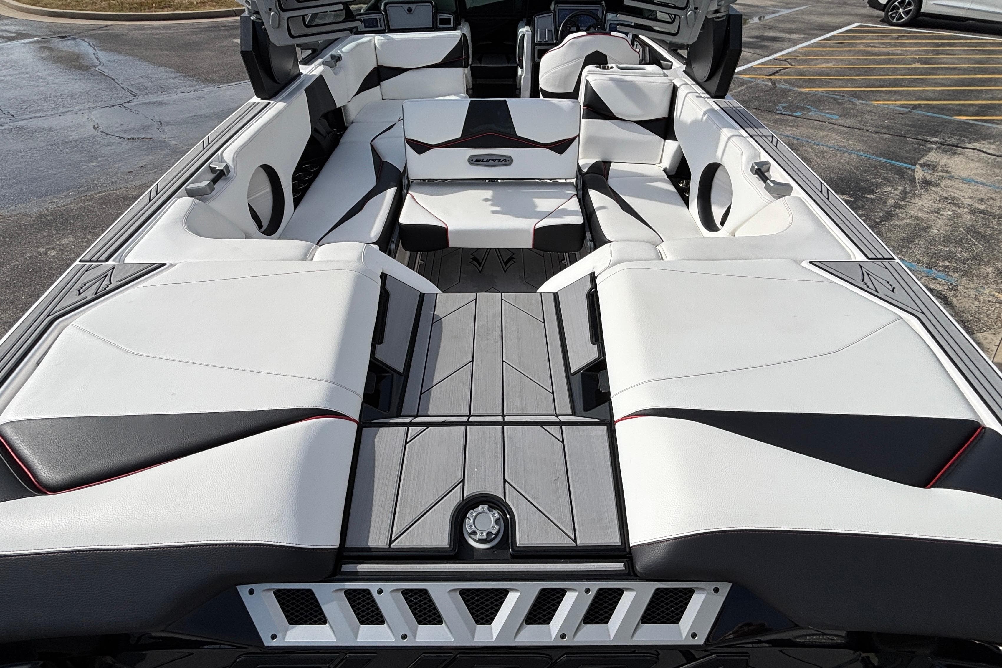 2019 Supra SL 450 boat interior with white and black seating, modern design.