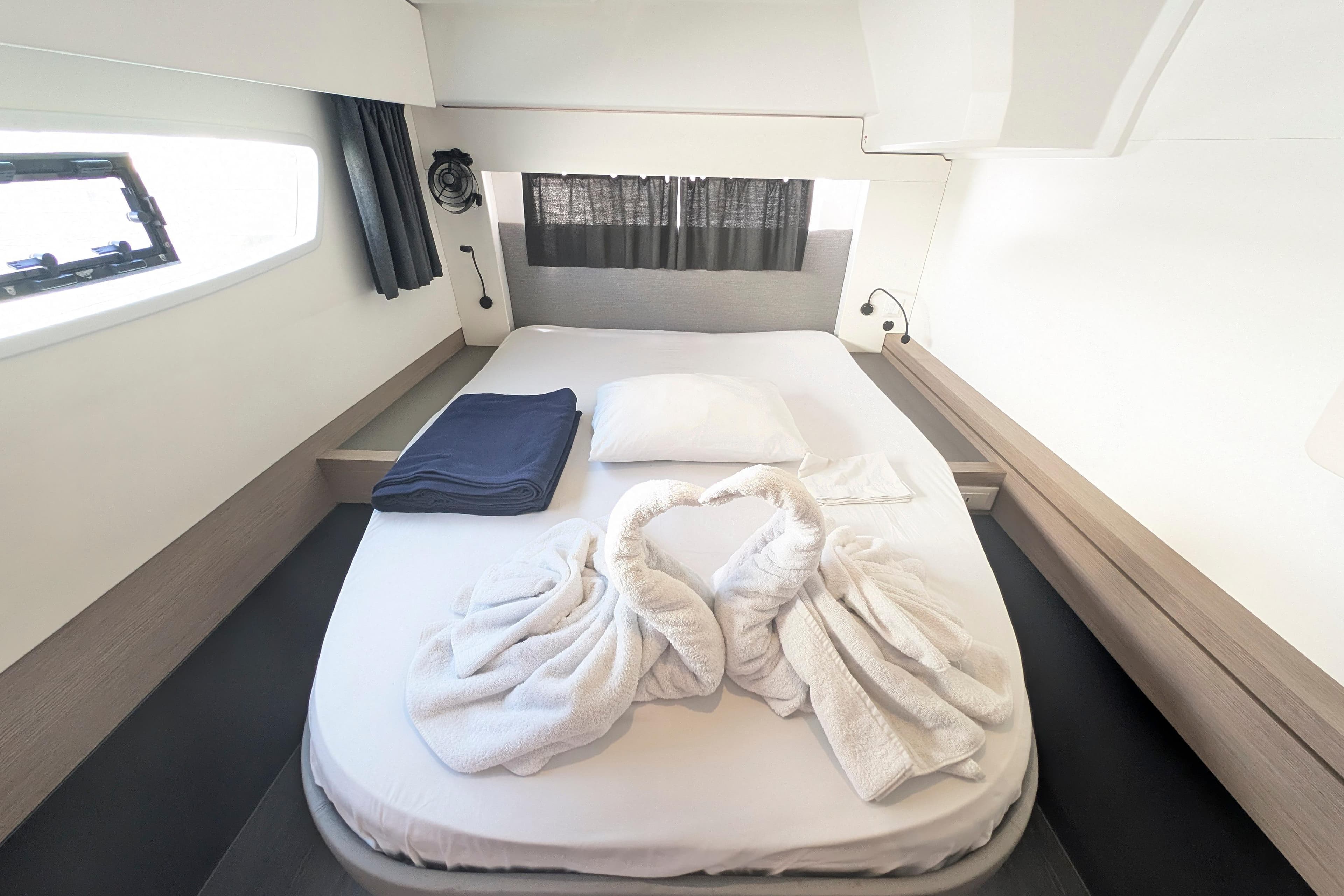 Luxurious cabin interior of 2020 Fountaine Pajot Astrea 42 with elegant bedding.