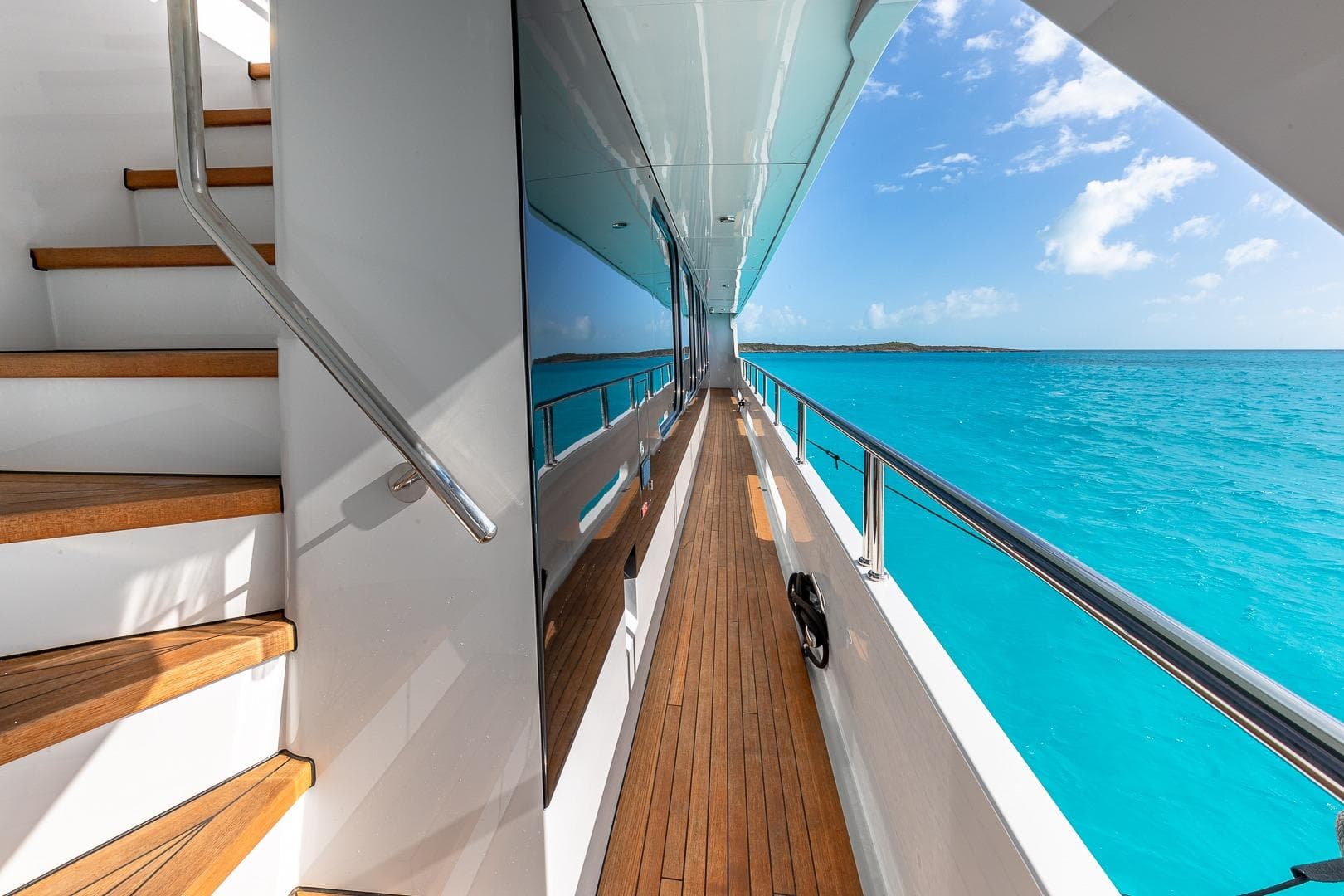 Luxurious 2005 Christensen motor yacht deck with stunning ocean view.