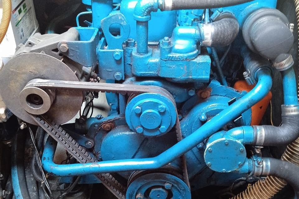 1983 Cape Dory 36 engine, blue components, belts, and hoses visible.