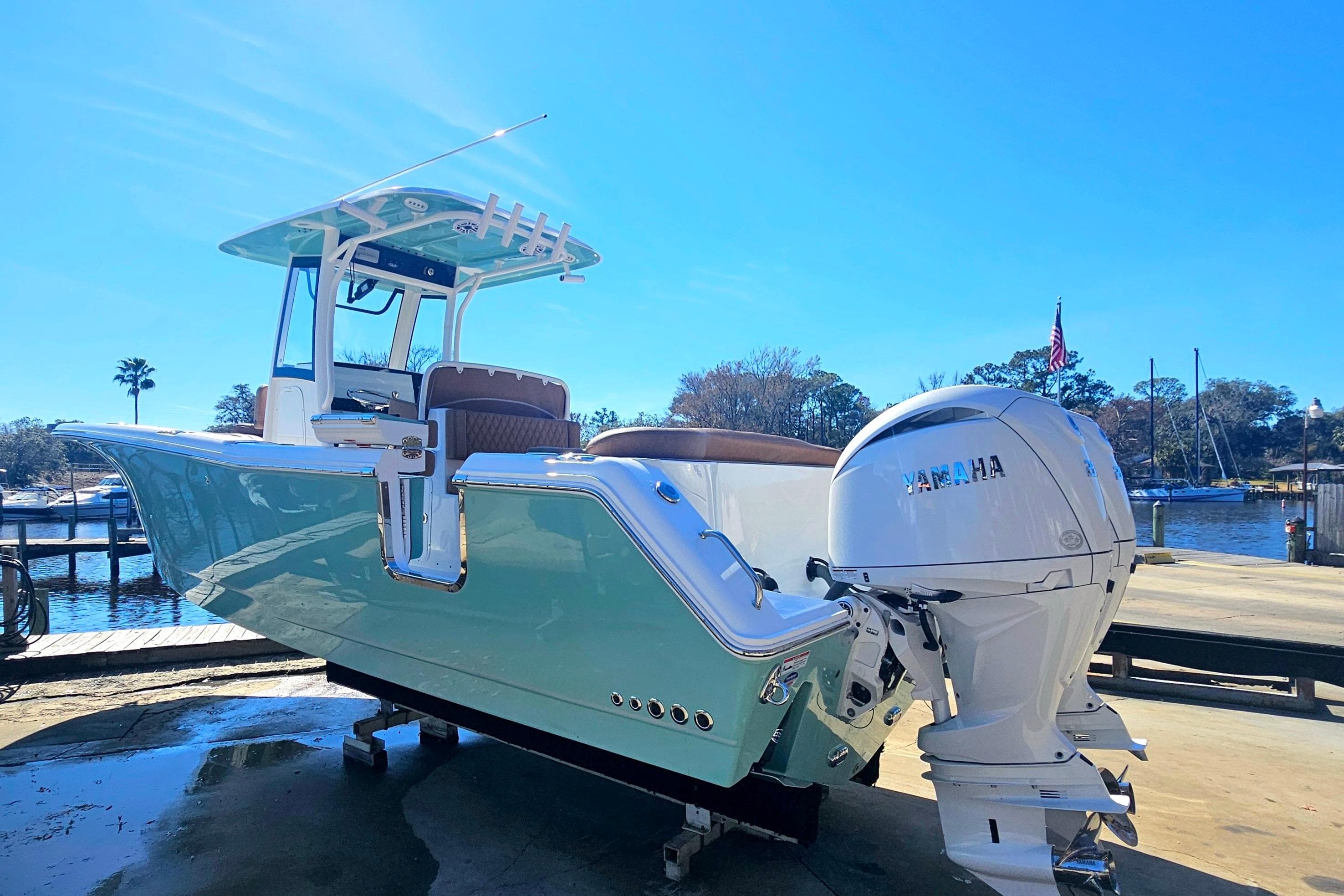 2026 Sea Hunt Ultra 275 Coffin Box boat with Yamaha engine at dockside.