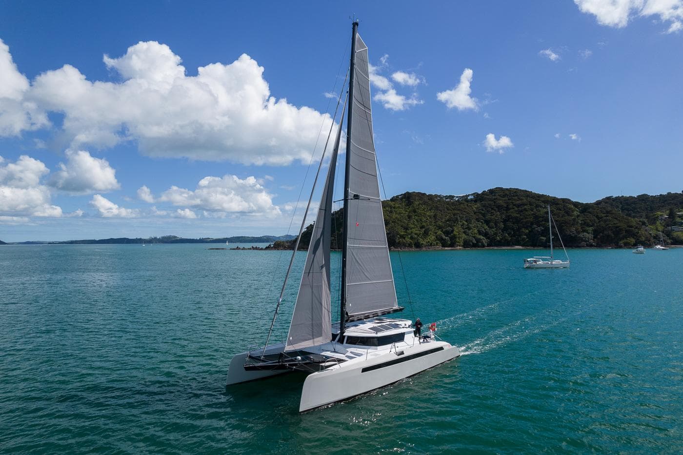 2014 Alibi 54 catamaran sailing on blue waters.