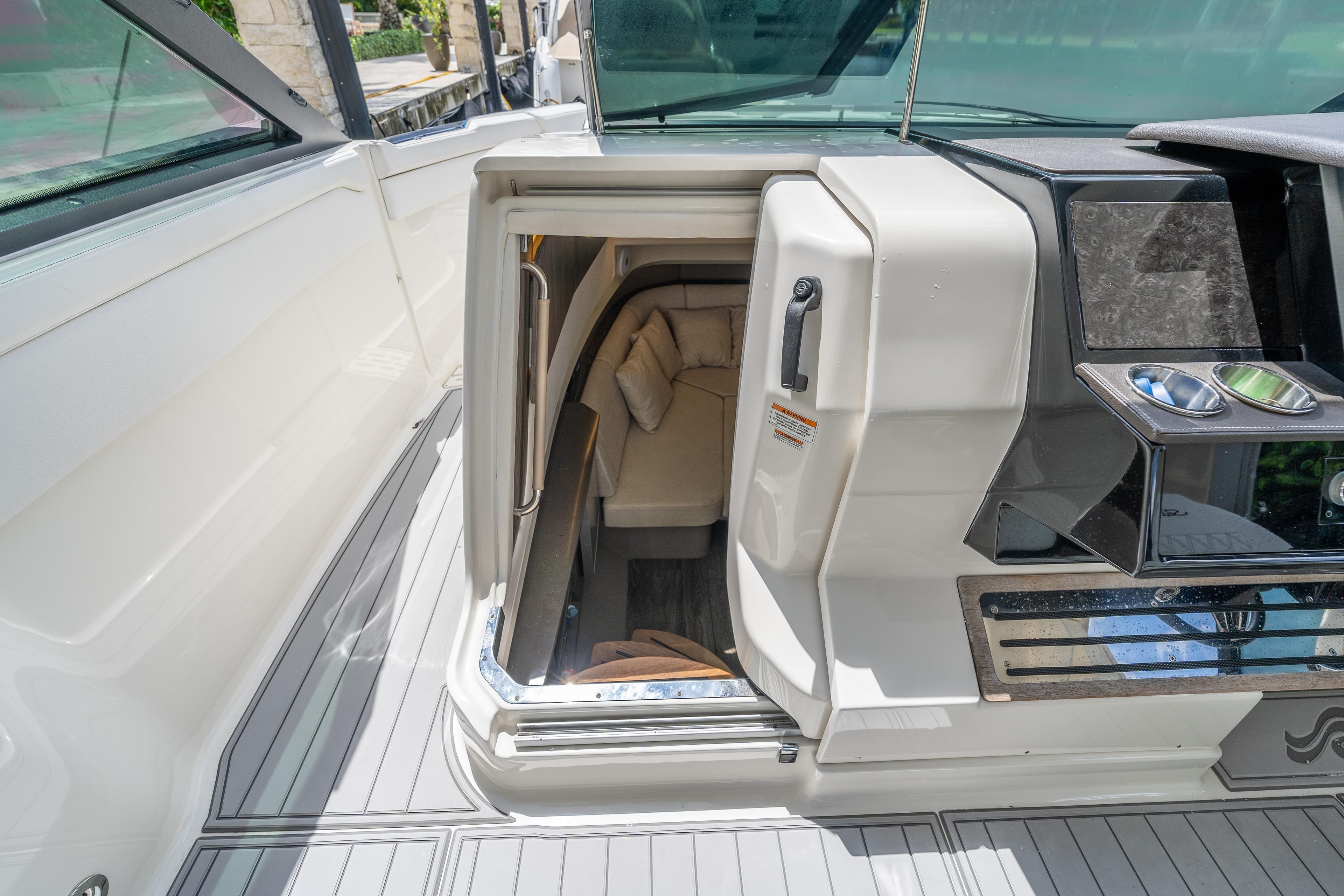 2019 Sea Ray SLX 400 Outboard cabin entrance with sleek interior design.