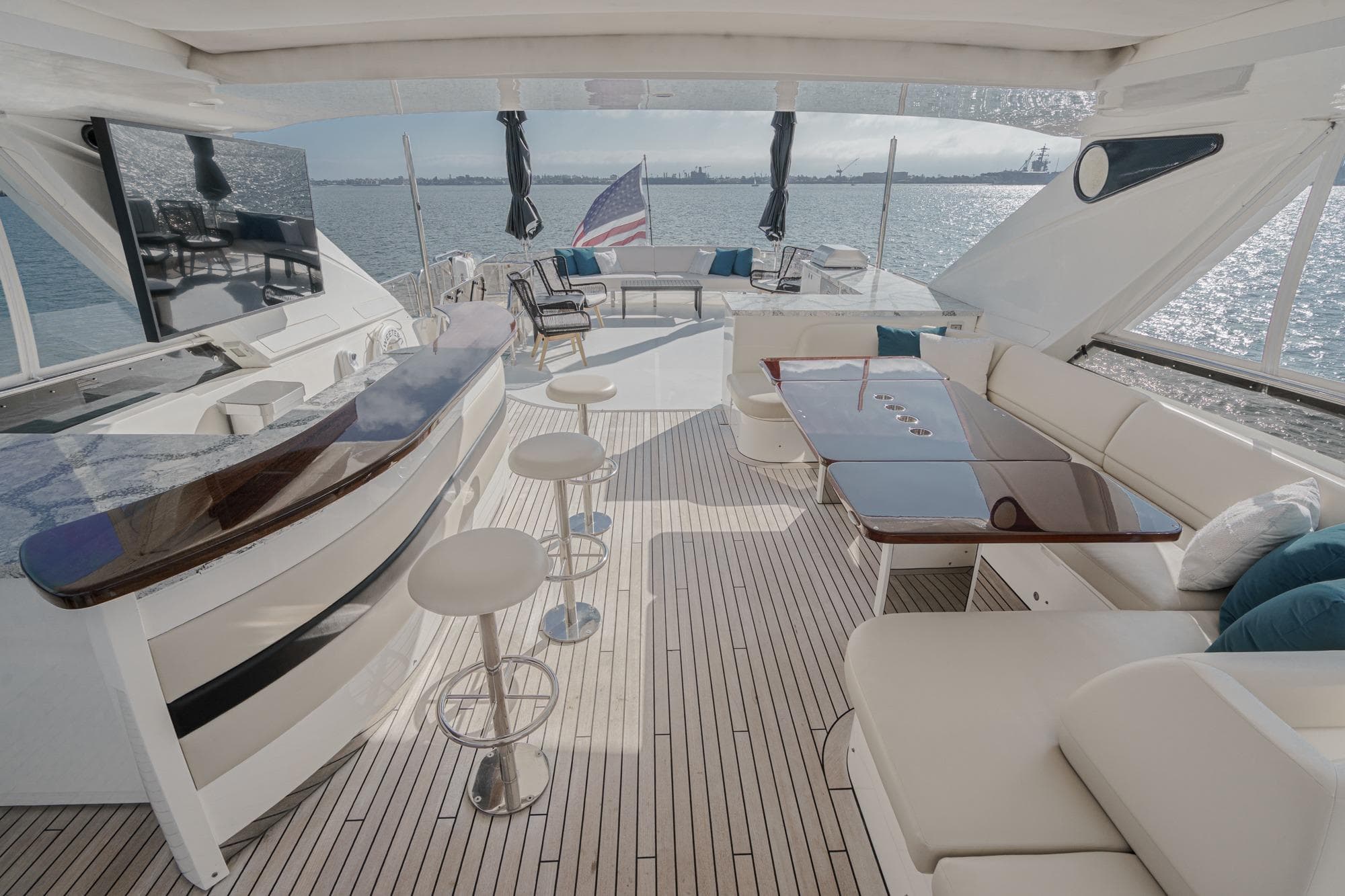 Luxurious 2011 Princess 95 Motor Yacht deck with seating, bar, and ocean view.