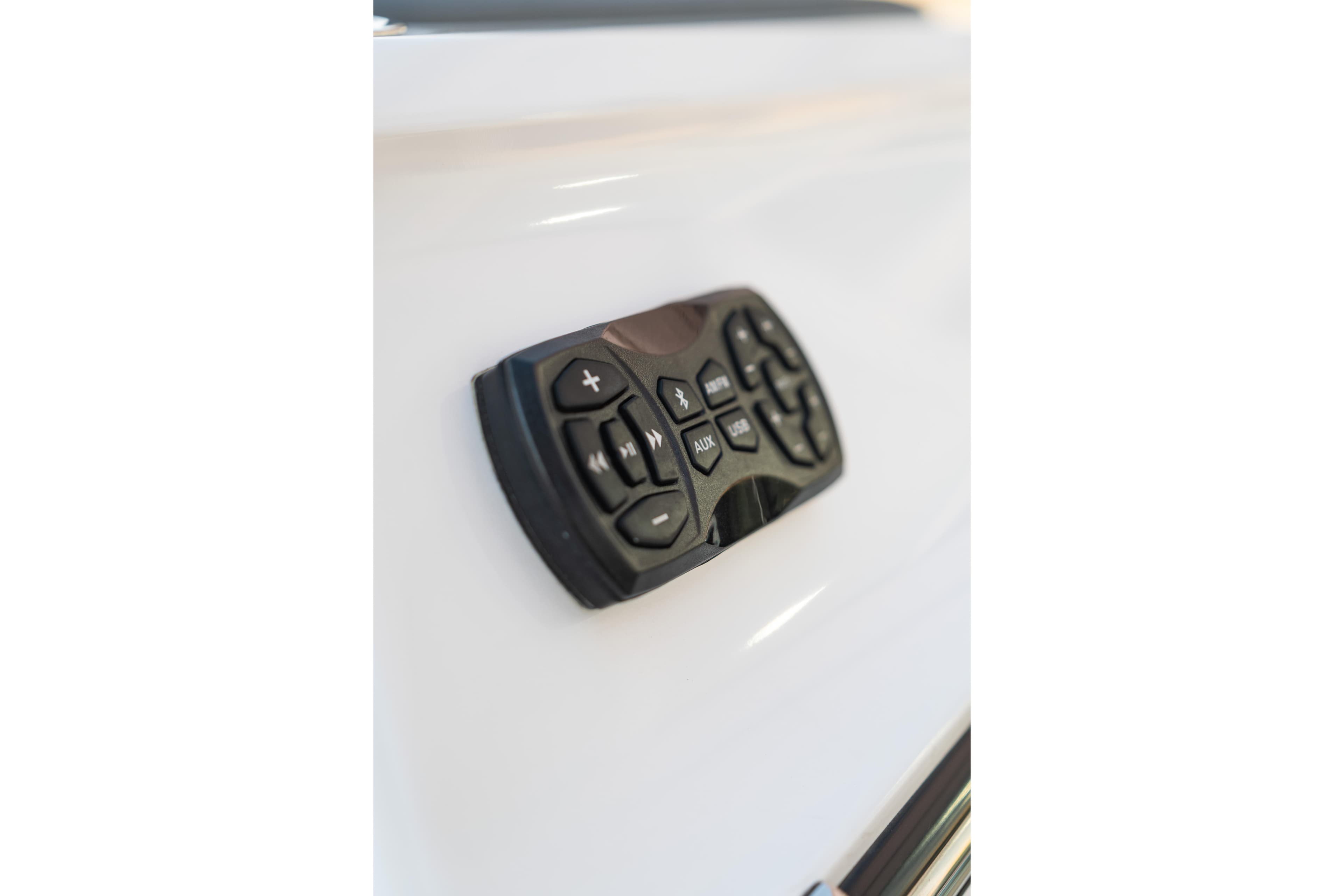 Control panel on 2022 MasterCraft XStar boat, featuring various function buttons.
