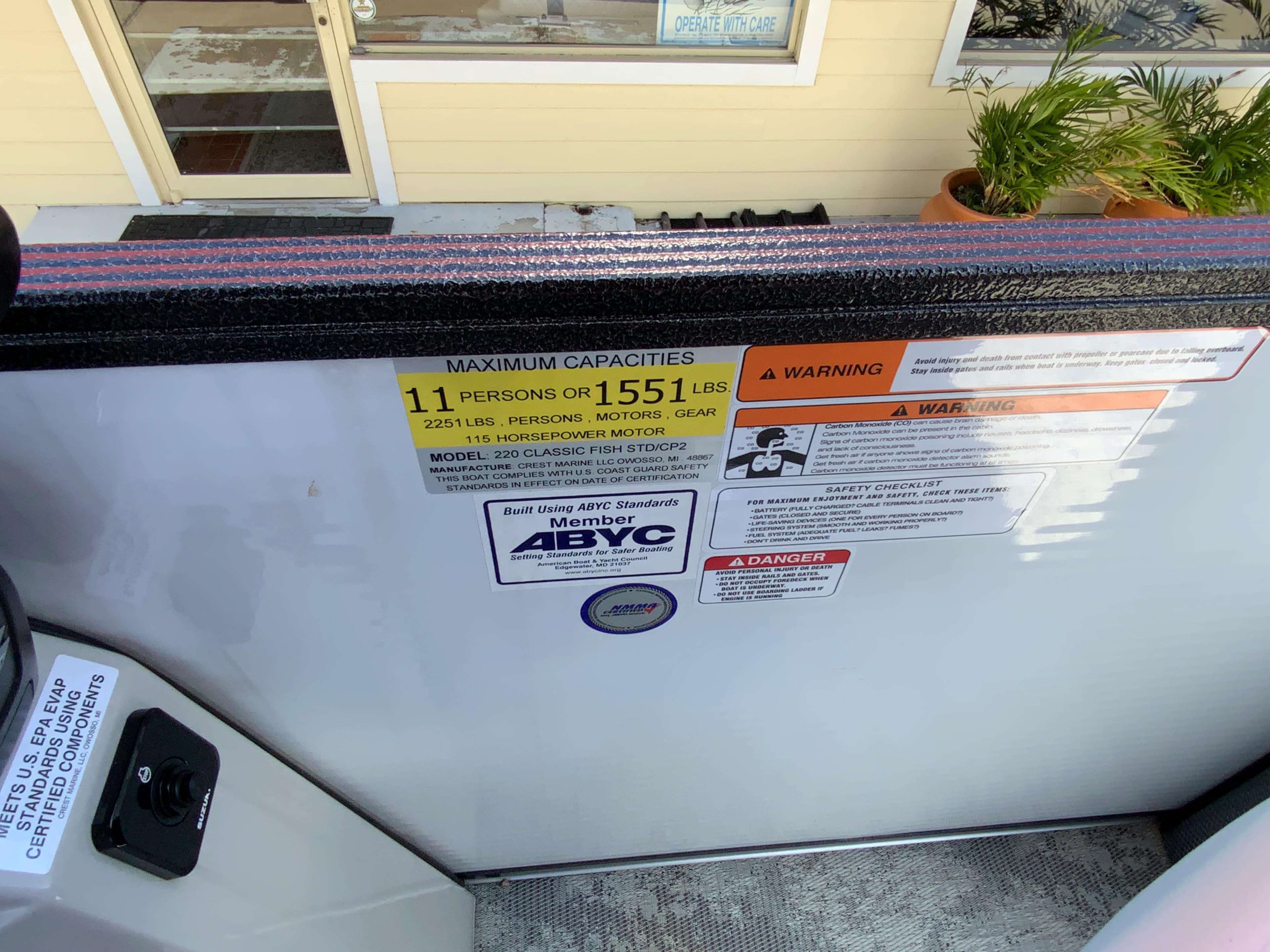 2023 Crest Classic LX 220 SF boat capacity and safety warning labels.
