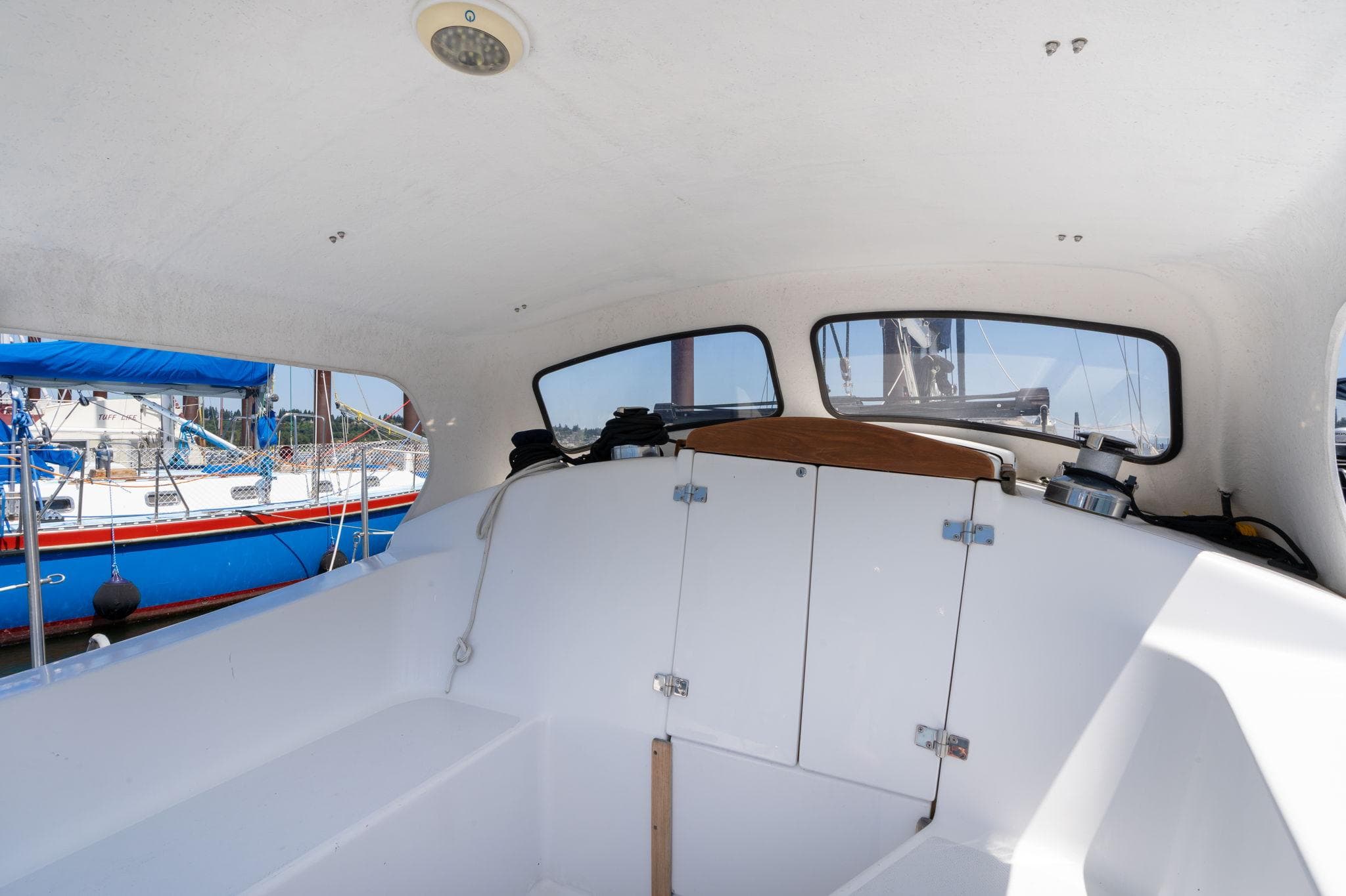 Interior view of a 1978 Cascade High Side boat with visible windows and storage compartments.