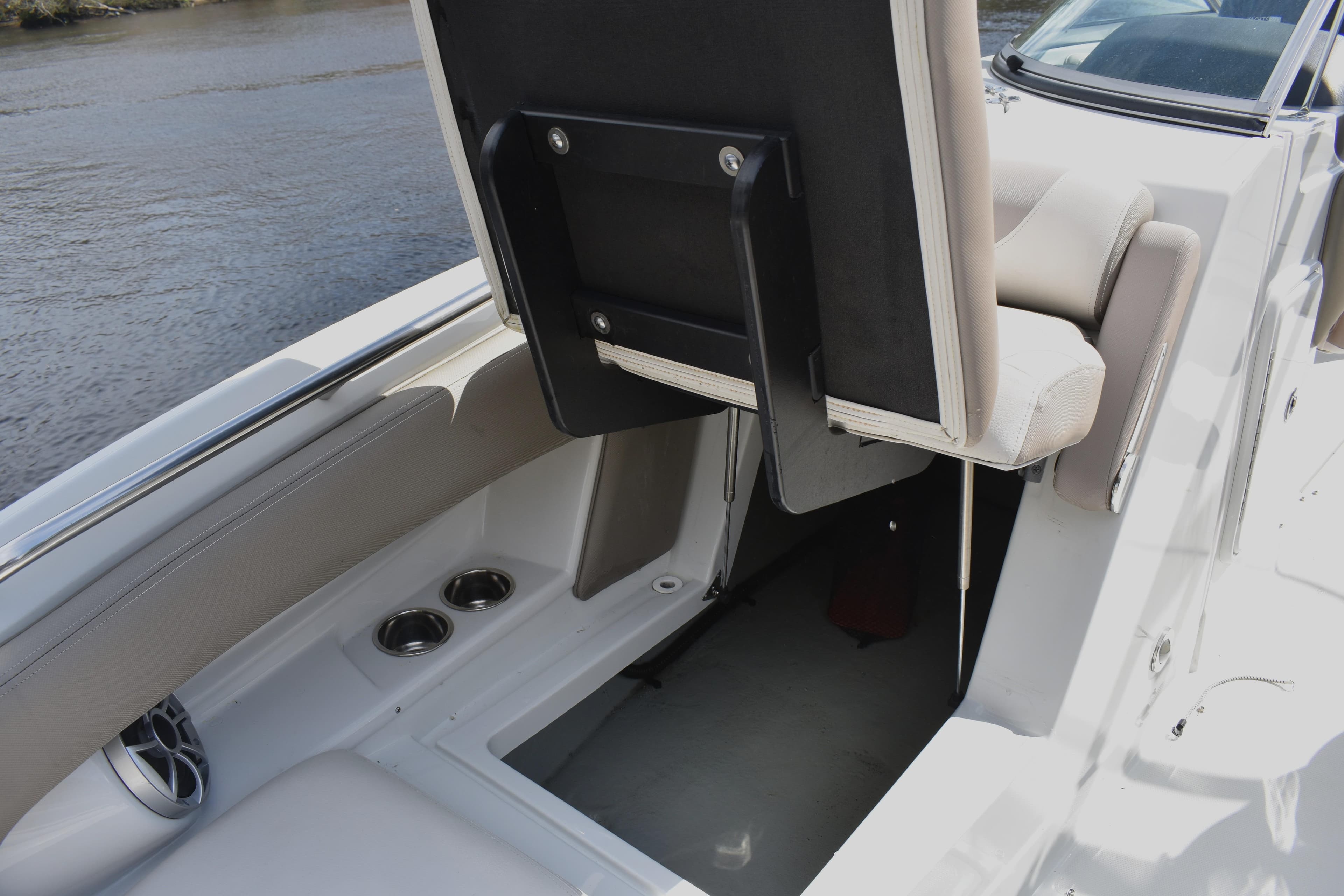 2019 Crownline Eclipse E255 SURF boat interior with storage compartment and seating.