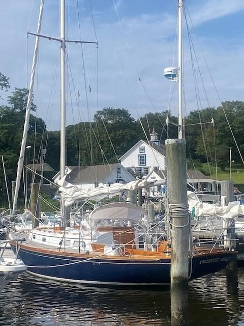 1968 Hinckley Pilot 35 sailboat docked in harbor.