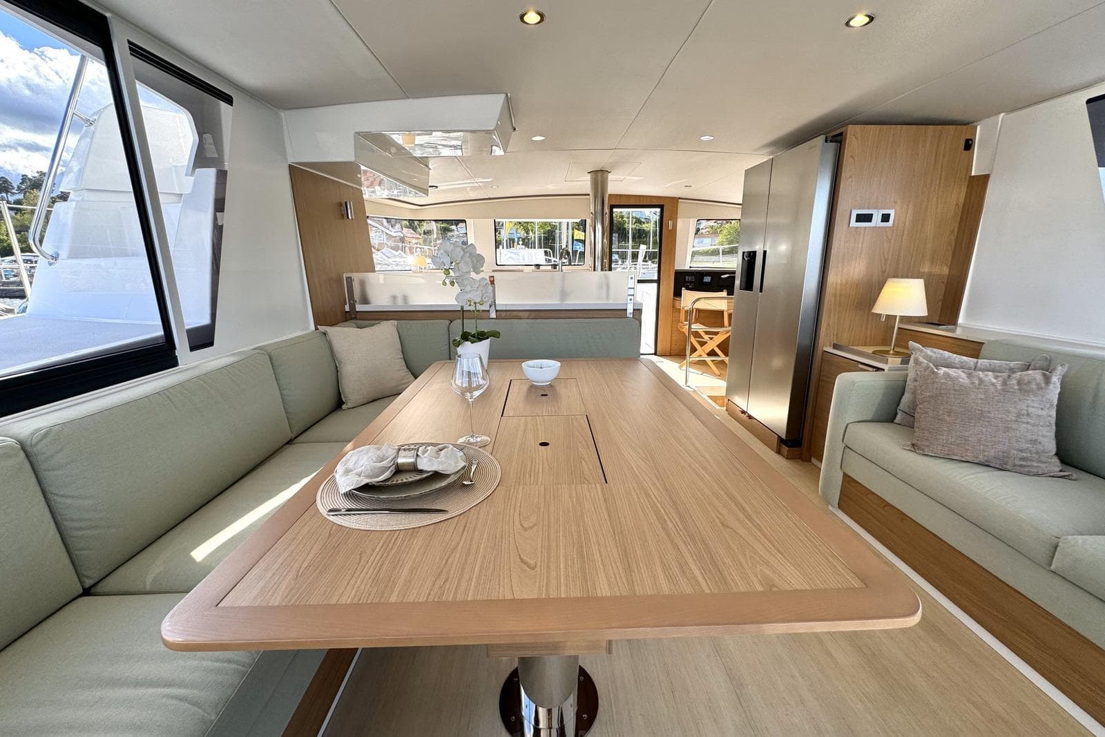 Luxurious interior of 2024 Bali 4.6 yacht with elegant dining area and modern furnishings.