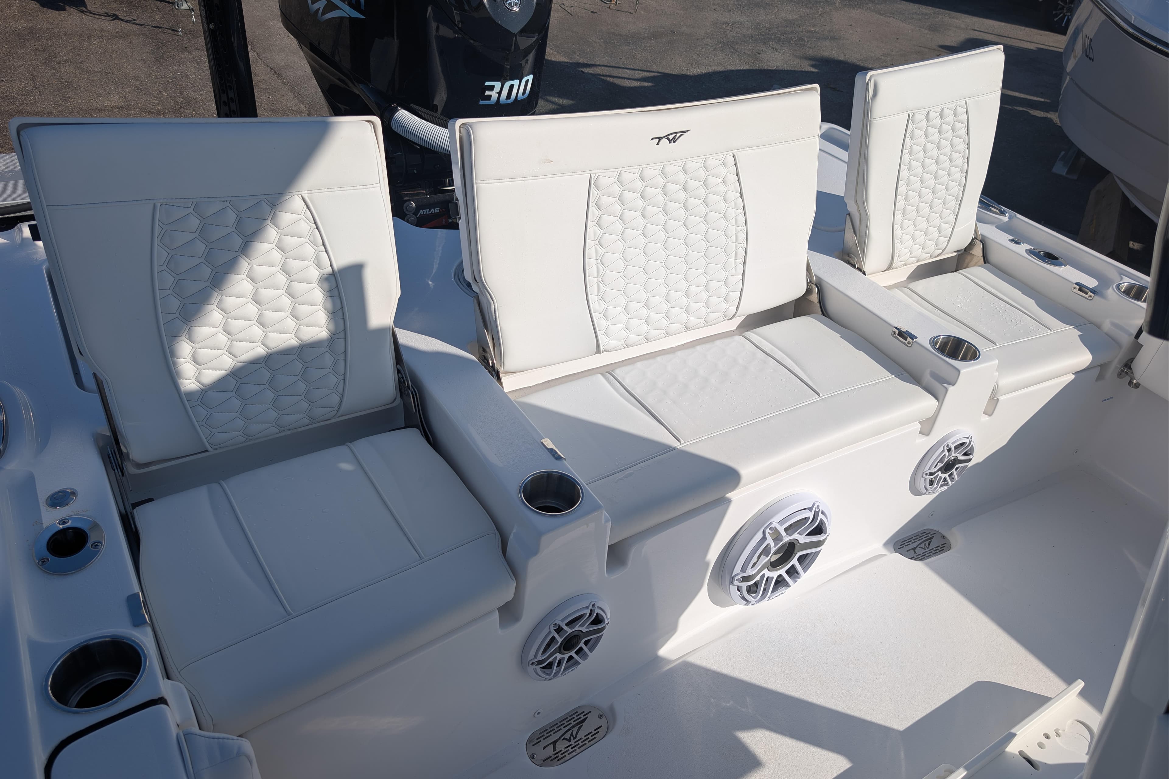 2026 Tidewater 2500 Carolina Bay boat seating with white upholstery and integrated speakers.
