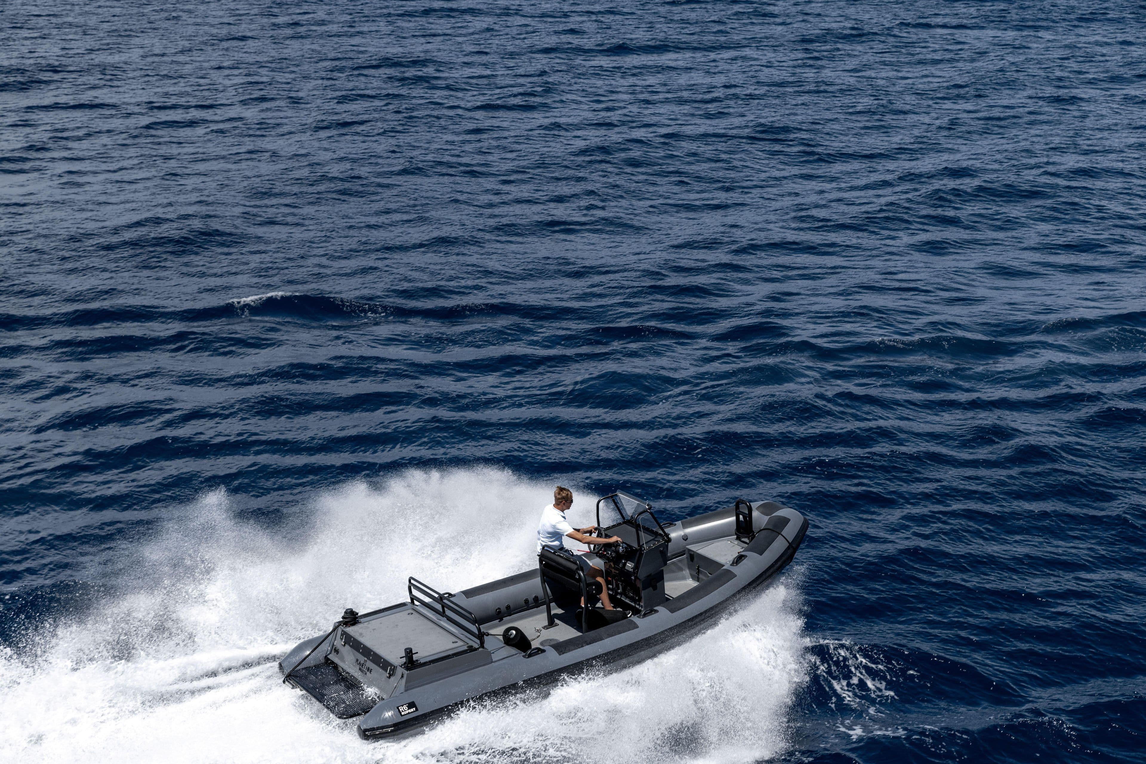 2017 Rupert 6M Tender speeding across the ocean waves.