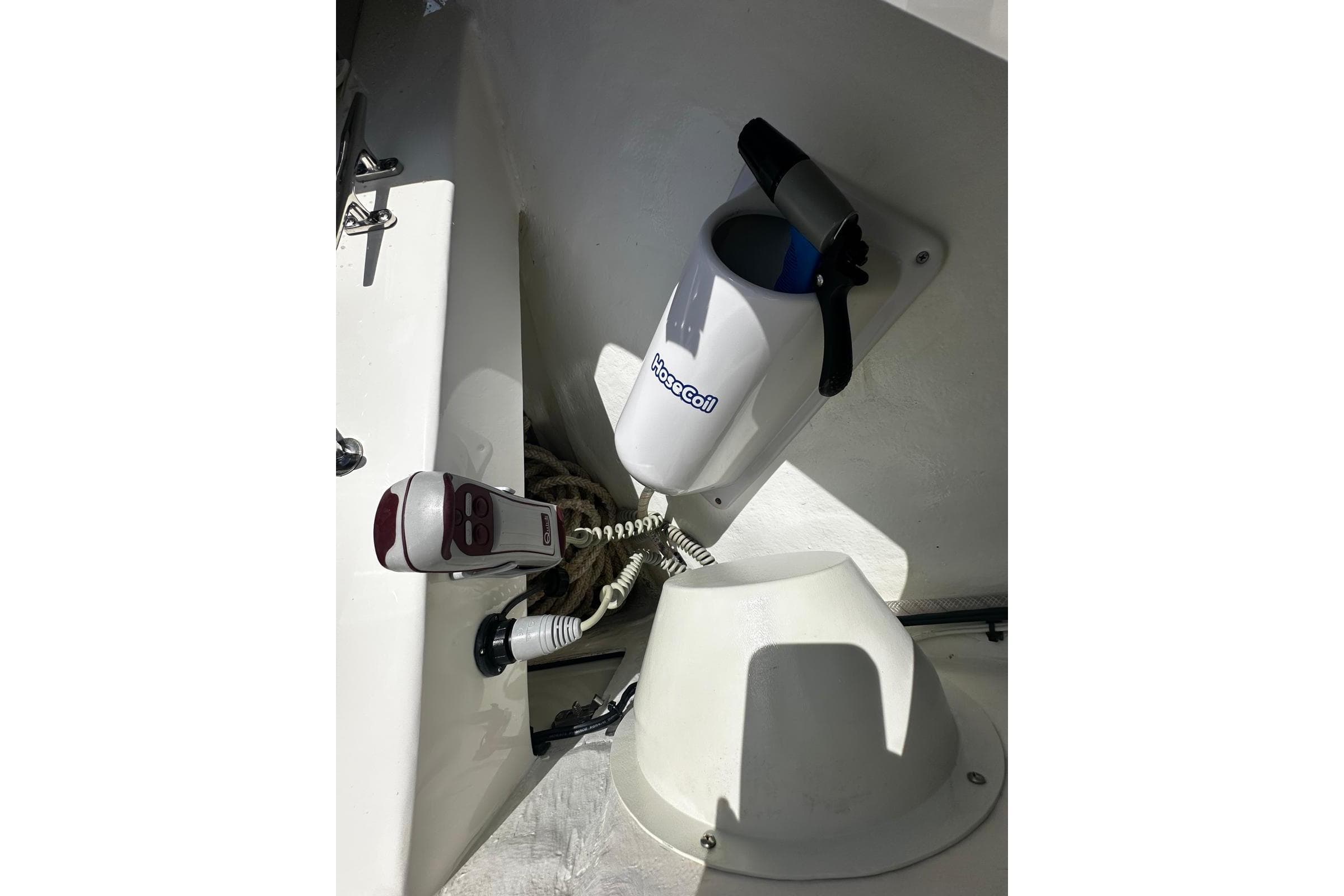 2022 SeaVee 390Z boat interior with hose and equipment storage.