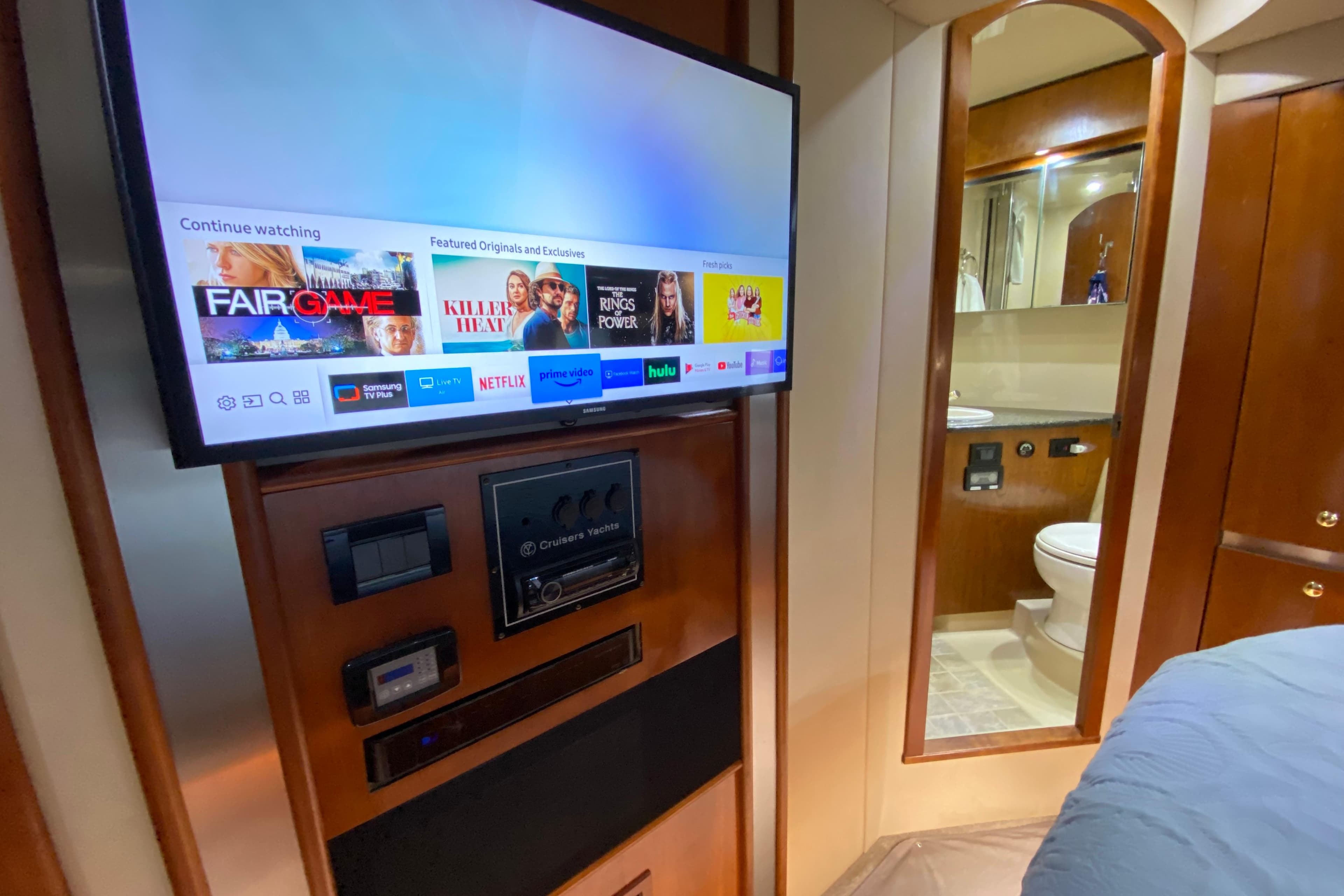 Interior of 2006 Cruisers Yachts 520 Express with TV and bathroom view.
