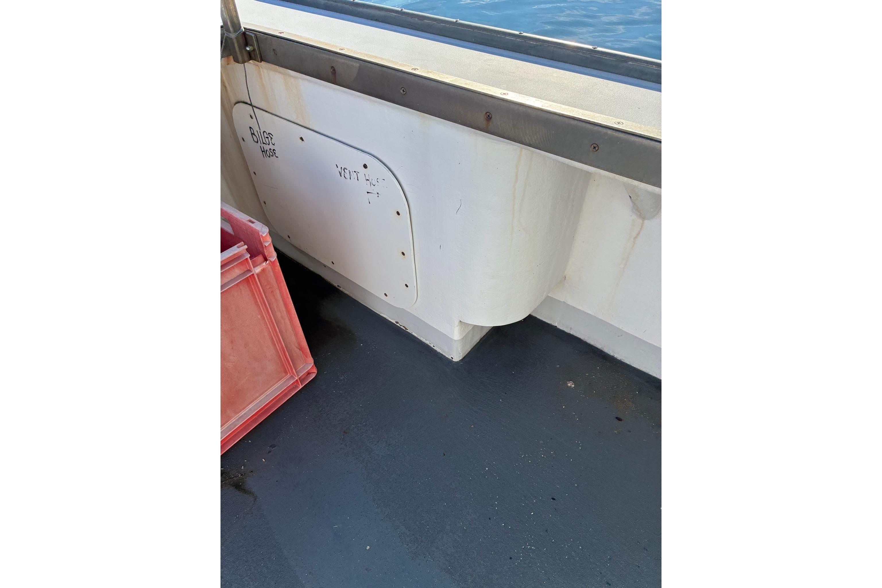 Interior view of a 2000 Calvin Beal COI PASSENGER boat, showing bilge hose area.