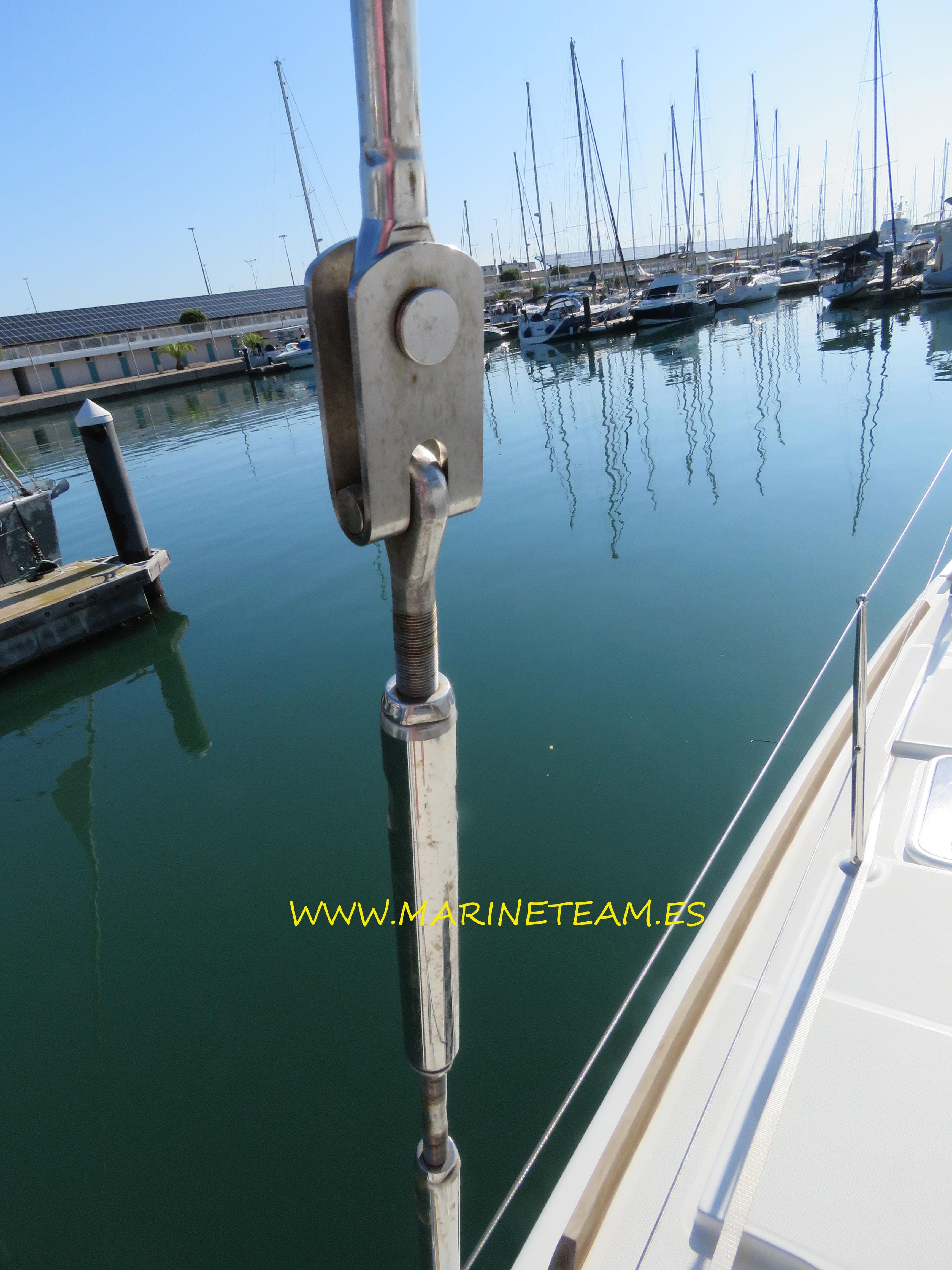 Close-up of a 2015 Lagoon 400 S2 sailboat rigging in a marina setting.
