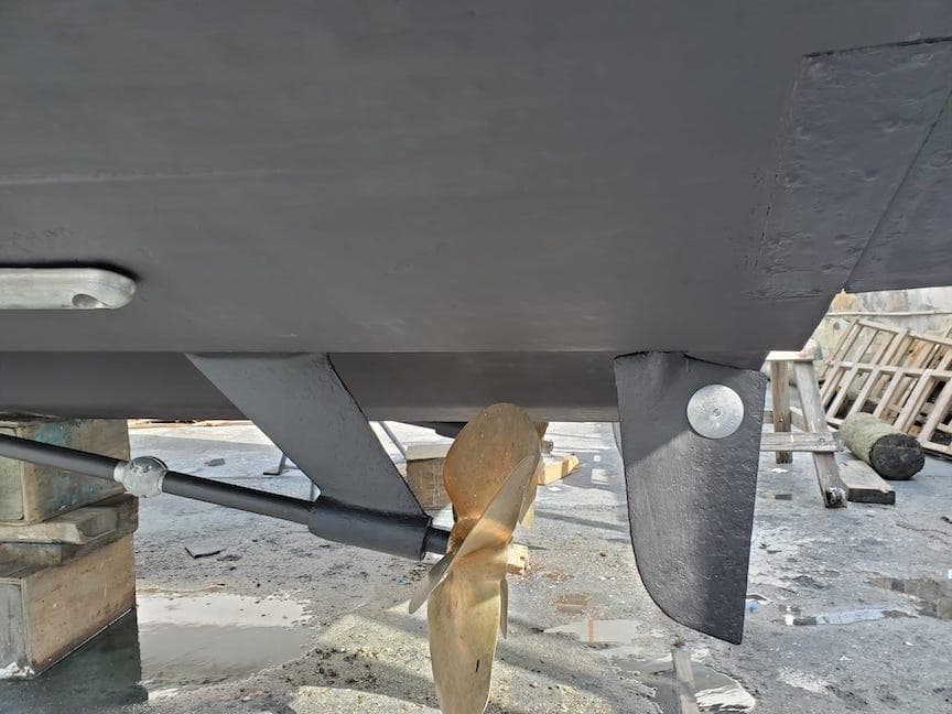 1998 Viking Sports Cruiser propeller and rudder detail in dry dock.