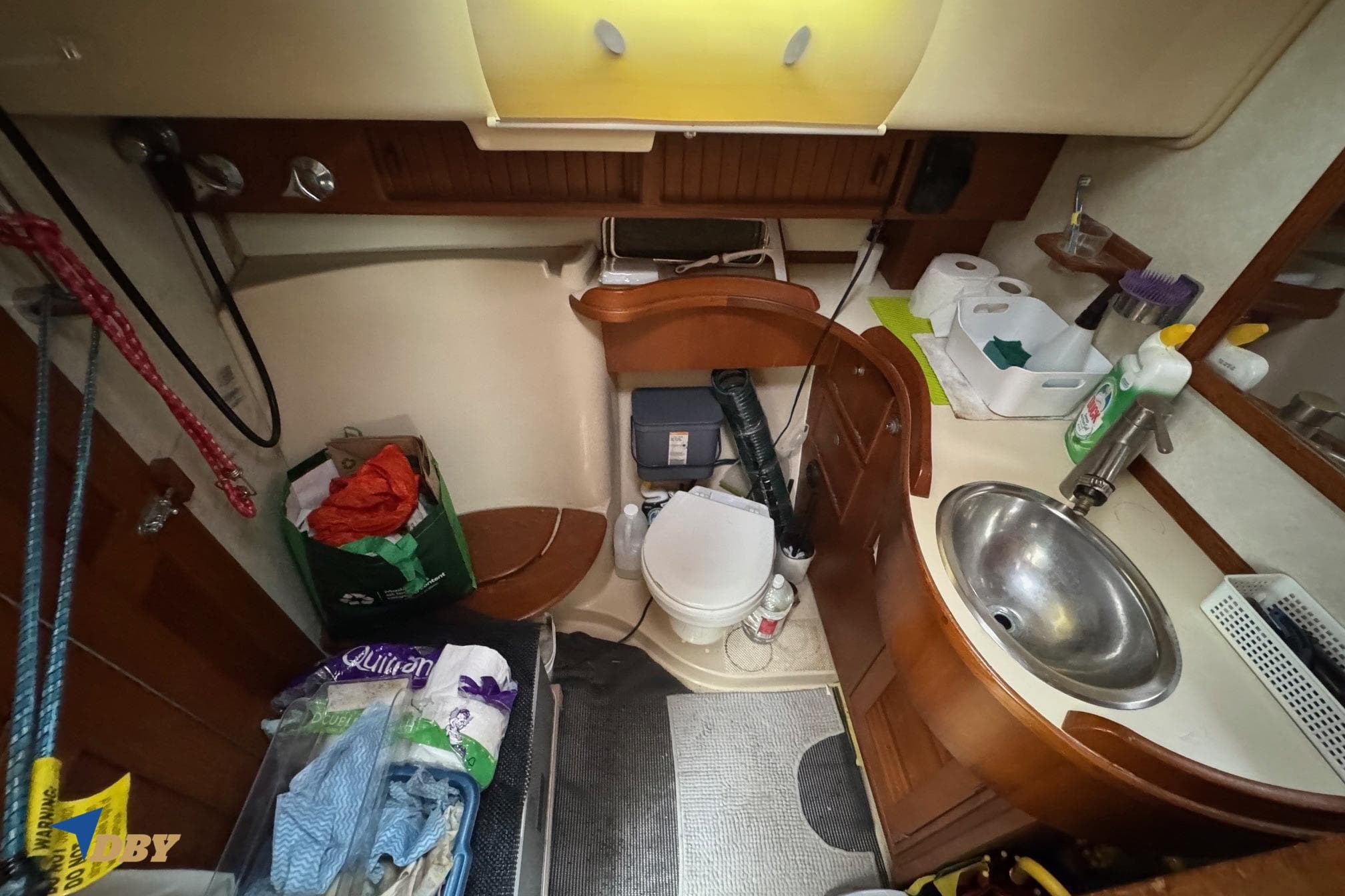 Bathroom interior of a 1998 Island Packet 45 yacht, featuring a sink and toilet.
