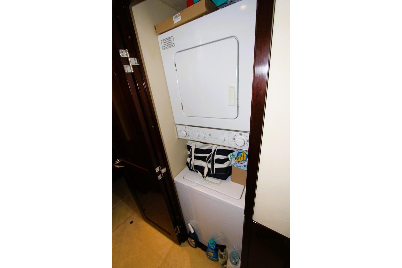 Stacked washer and dryer in 2007 Sea Ray 580 Sedan Bridge yacht.