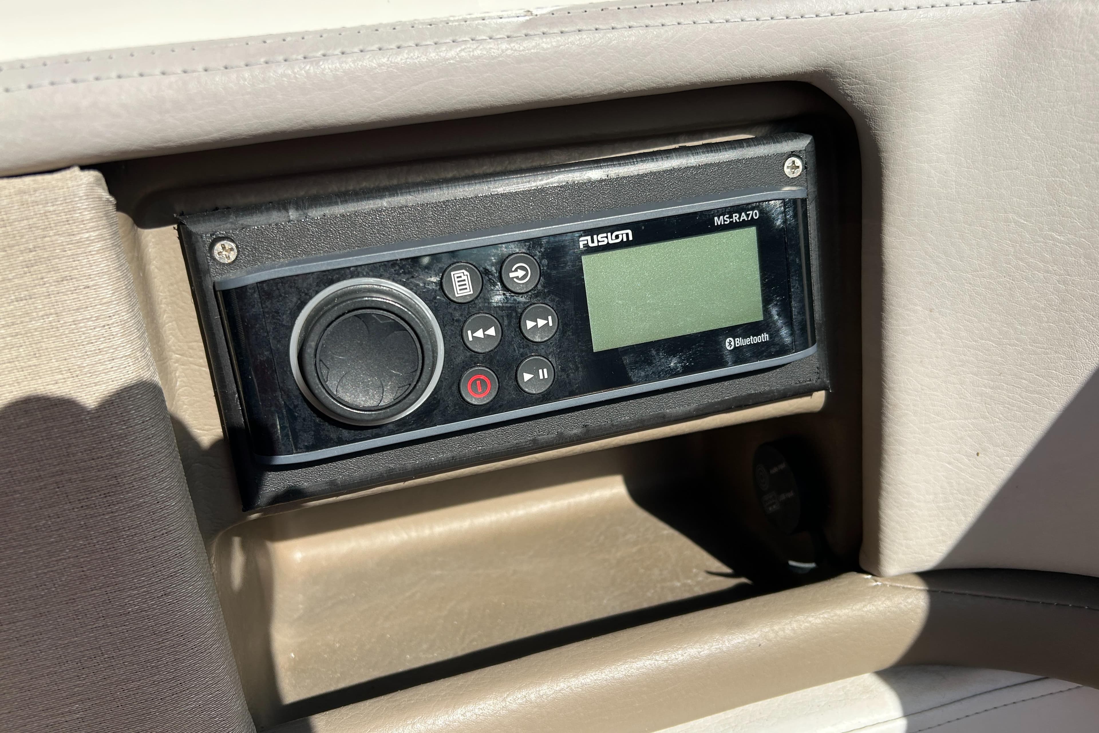 Fusion marine stereo system on 2013 Sea Ray 270 SLX boat dashboard.