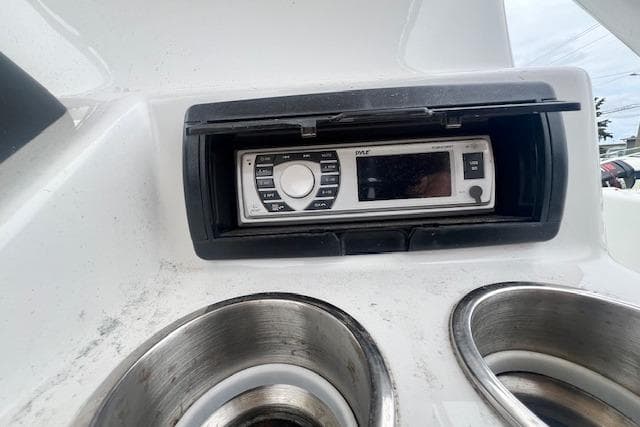 Boat dashboard with stereo system and cup holders, Key Largo 2100 WI, 2019 model.