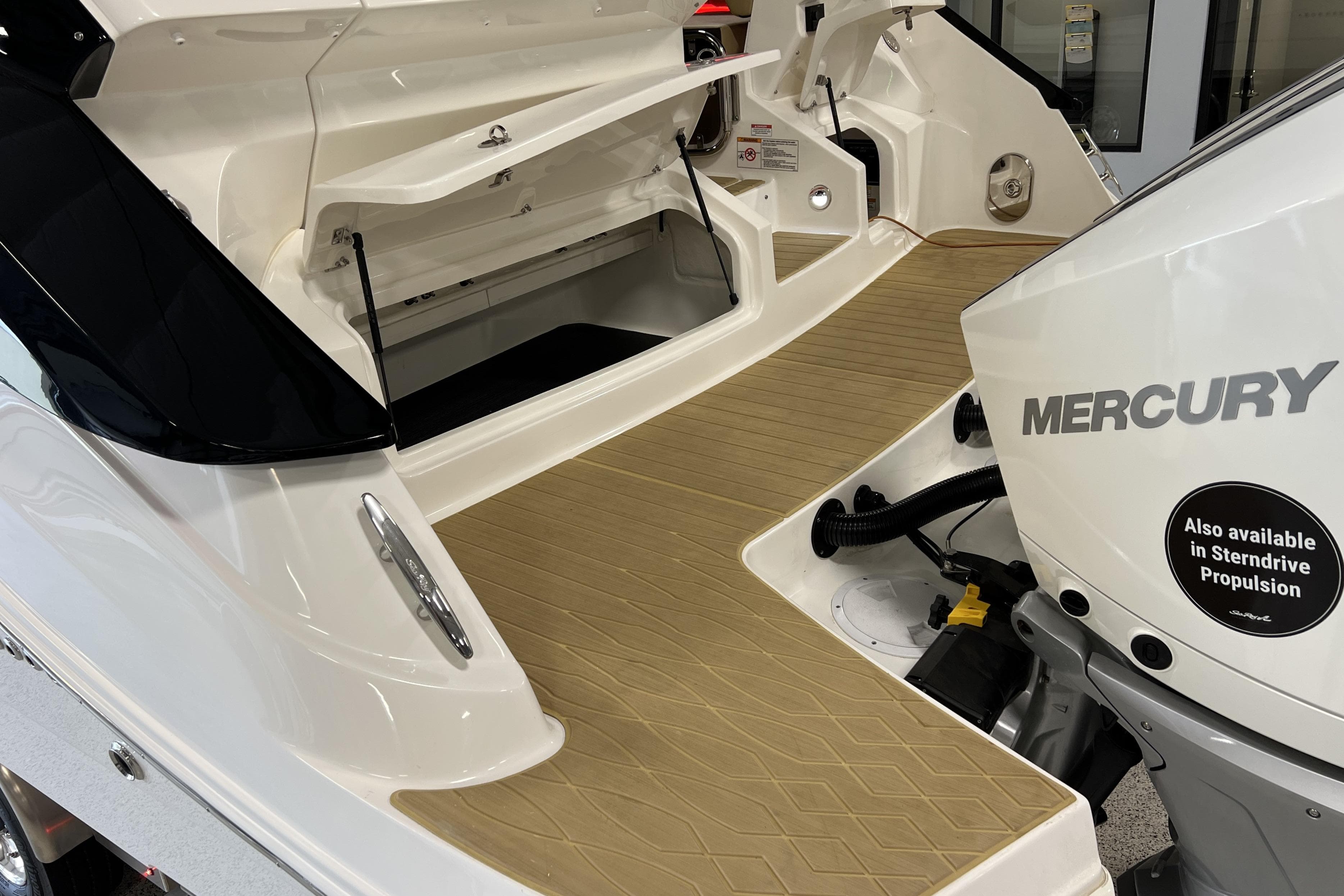 2025 Sea Ray Sundancer 370 Outboard with Mercury engine, showcasing spacious deck and storage.