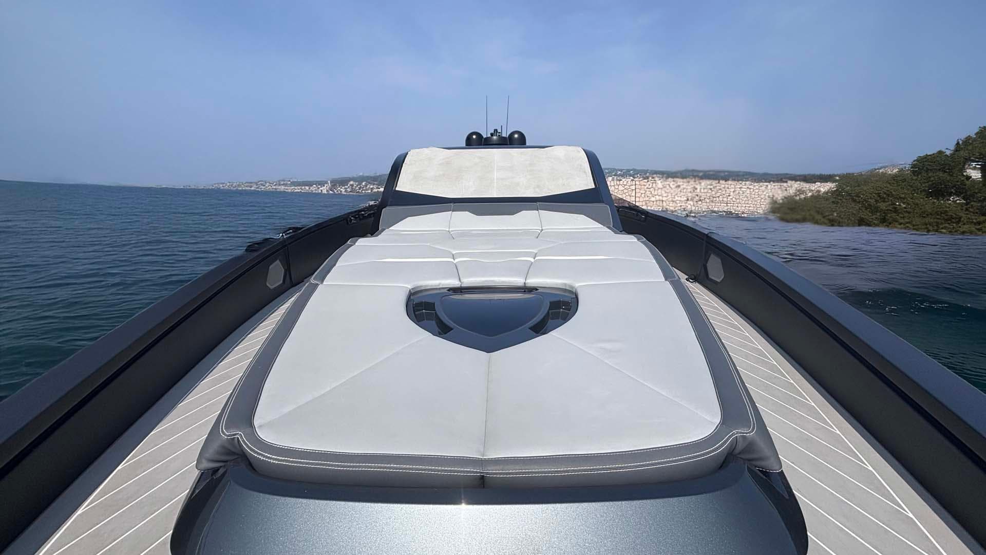 Luxury Tecnomar Lamborghini 63 yacht deck with sleek design, 2022 model, on calm waters.