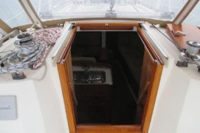 1989 Sabre 34 MK II sailboat cockpit with open cabin door and visible interior.