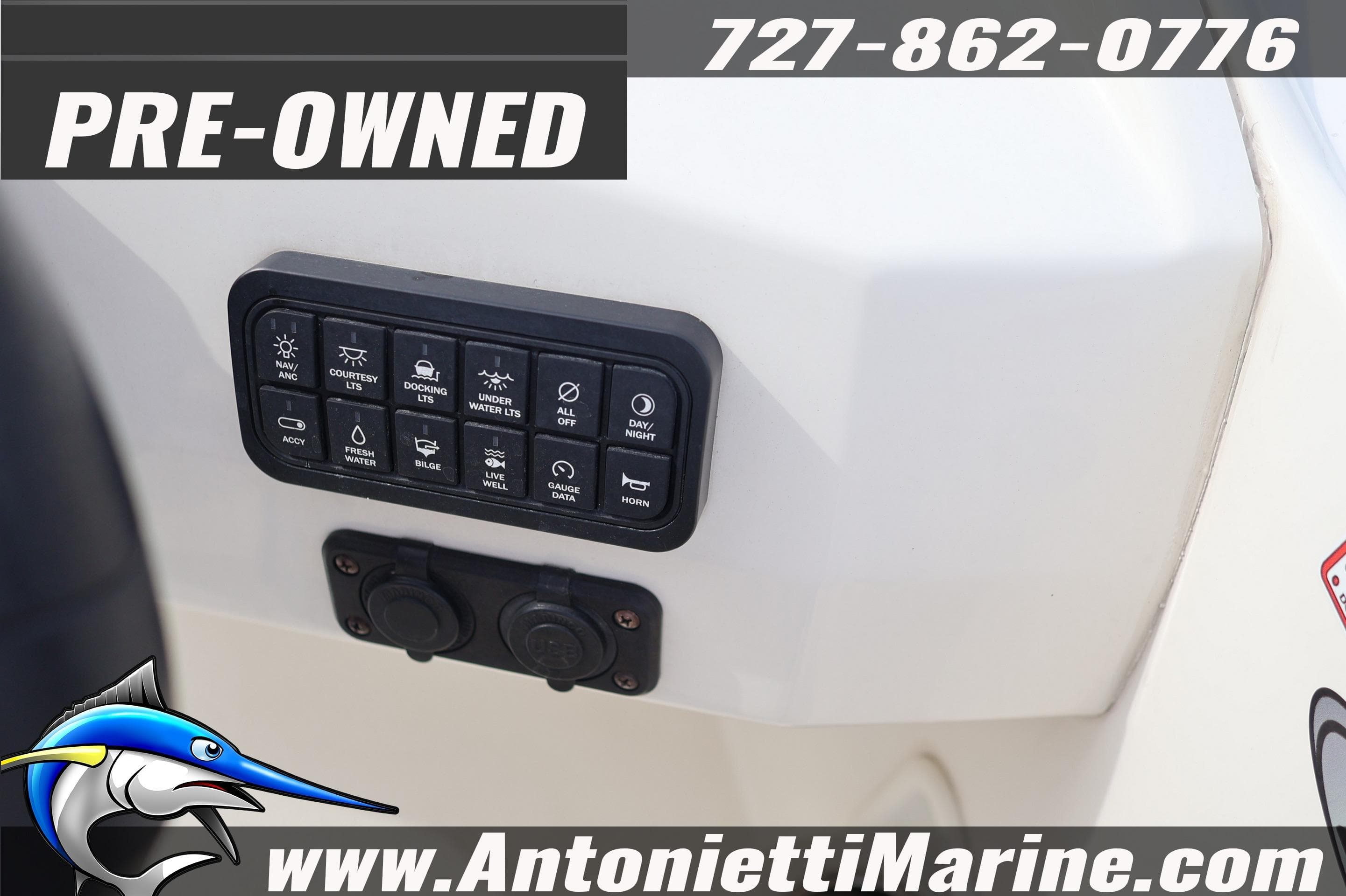 Pre-owned 2023 Stingray 212 SC boat control panel with various switches.