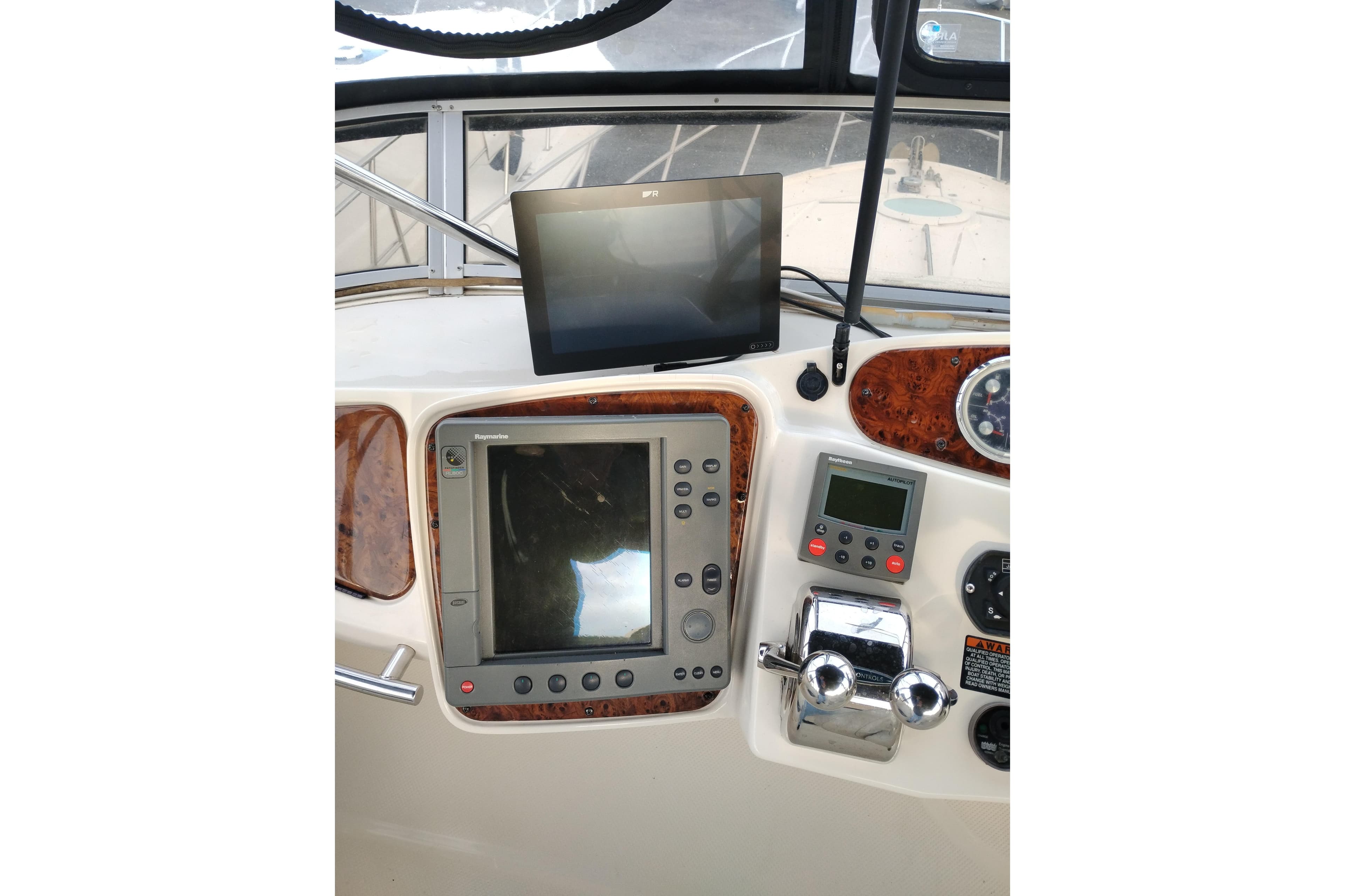 2004 Meridian 459 Motoryacht helm with navigation and control systems.