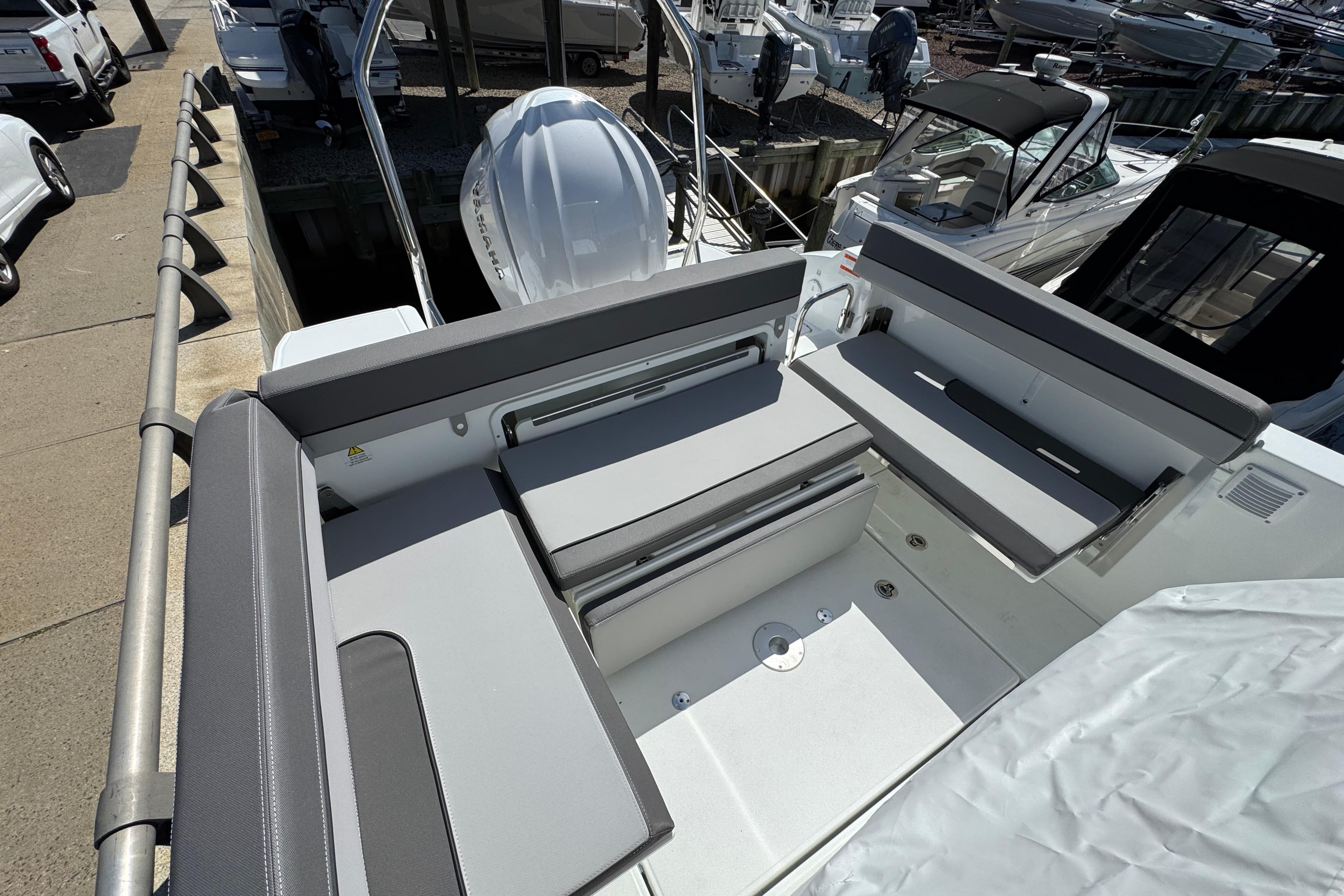2026 Jeanneau Leader WA 7.5 boat interior with gray seating and modern design.