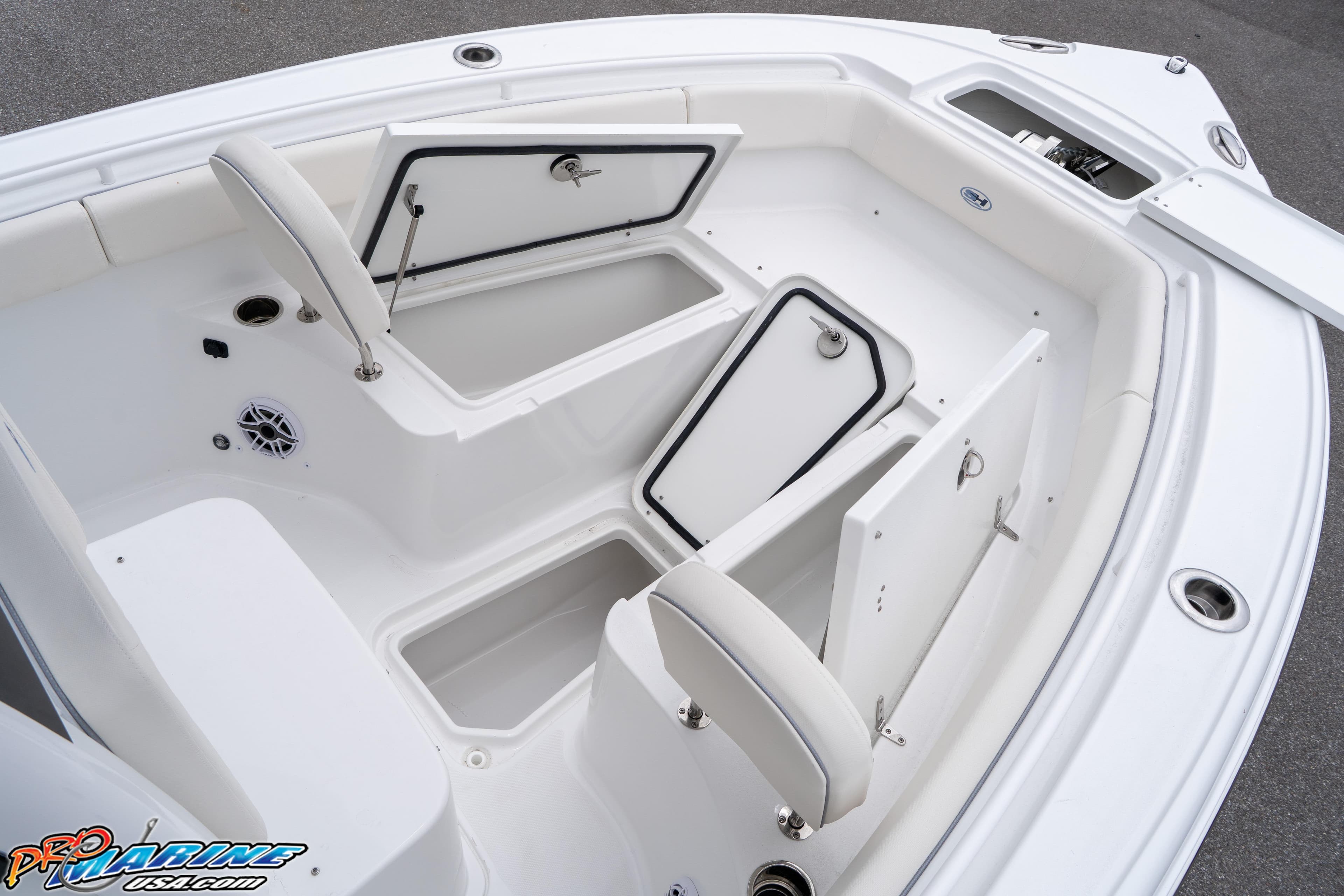2027 Sea Hunt Ultra 255 SE boat interior with open storage compartments and seating.